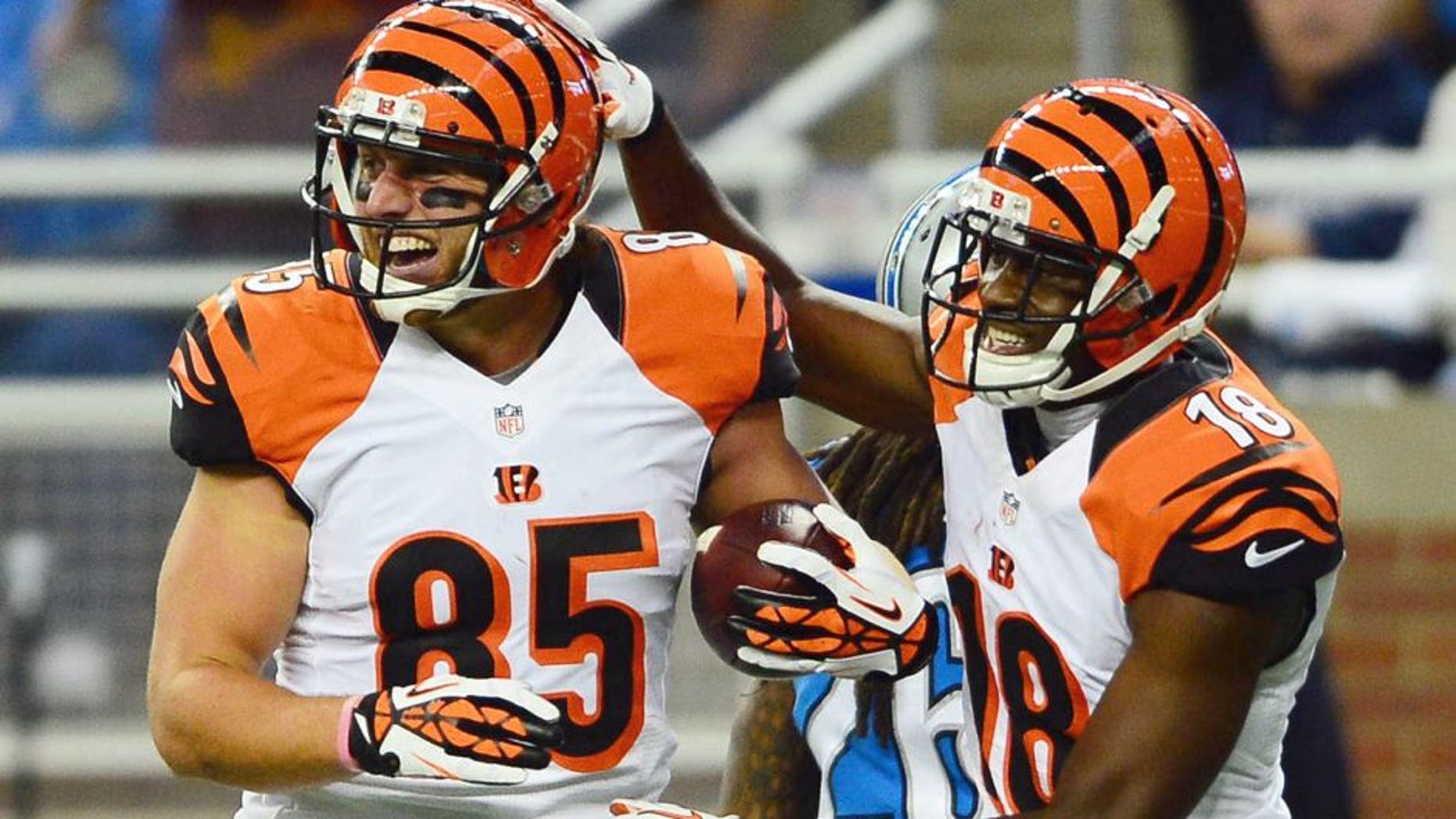 Oct 20, 2013; Detroit, MI, USA; Cincinnati Bengals wide receiver A.J. Green (18) congratulates tight end Tyler Eifert (85) after catching a pass for a touchdown during the third quarter against the Detroit Lions at Ford Field. Mandatory Credit: Andrew Weber-USA TODAY Sports