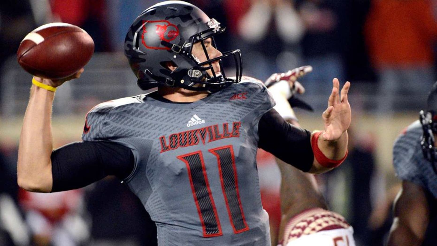 Oct 30, 2014; Louisville, KY, USA; Louisville Cardinals quarterback Will Gardner (11) looks to pass against the Florida State Seminoles during the first quarter at Papa John's Cardinal Stadium. Mandatory Credit: Jamie Rhodes-USA TODAY Sports
