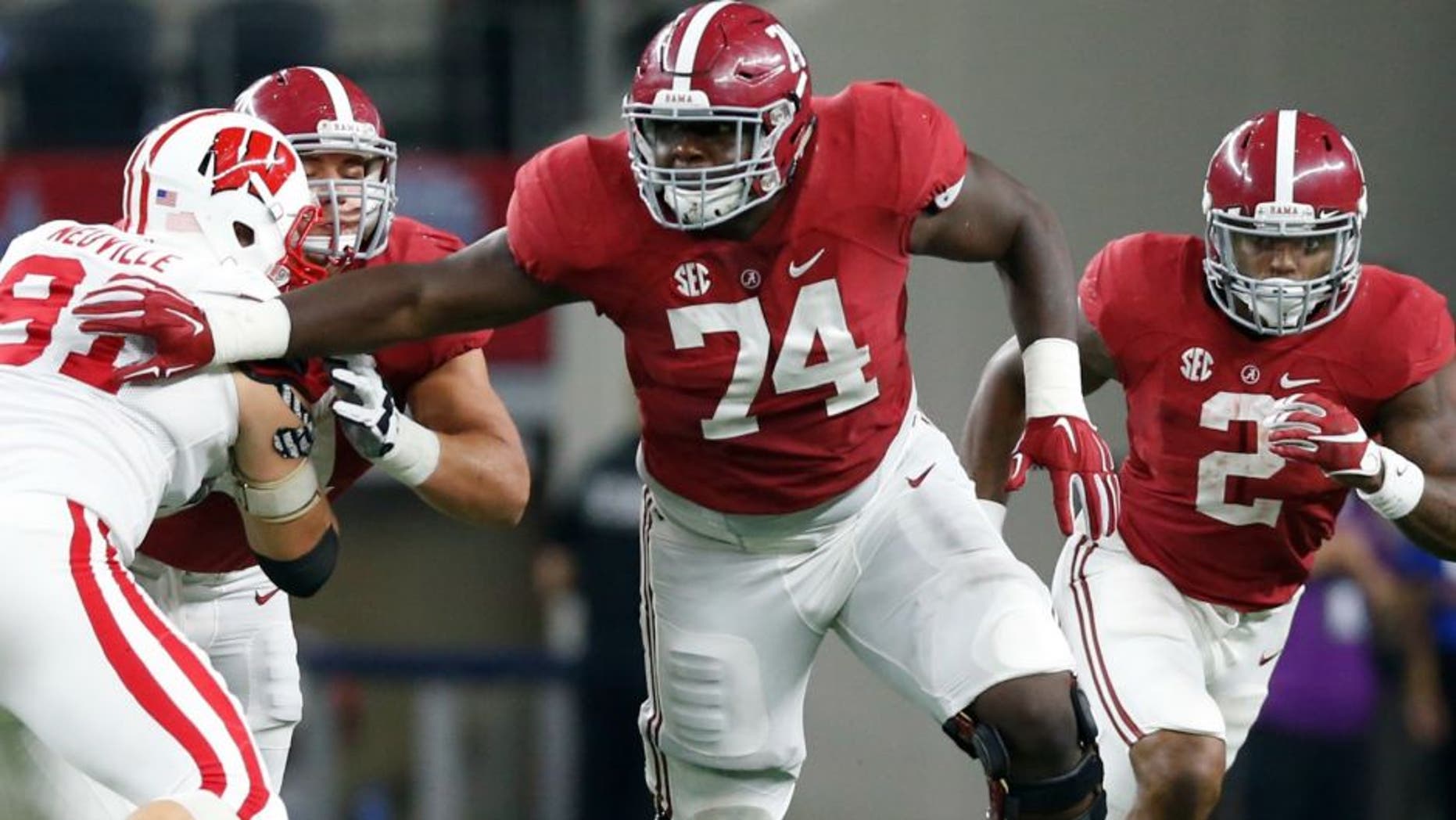Sep 5, 2015; Arlington, TX, USA; Alabama Crimson Tide tackle Cam Robinson (74) in action against the Wisconsin Badgers at AT&T Stadium. Mandatory Credit: Matthew Emmons-USA TODAY Sports
