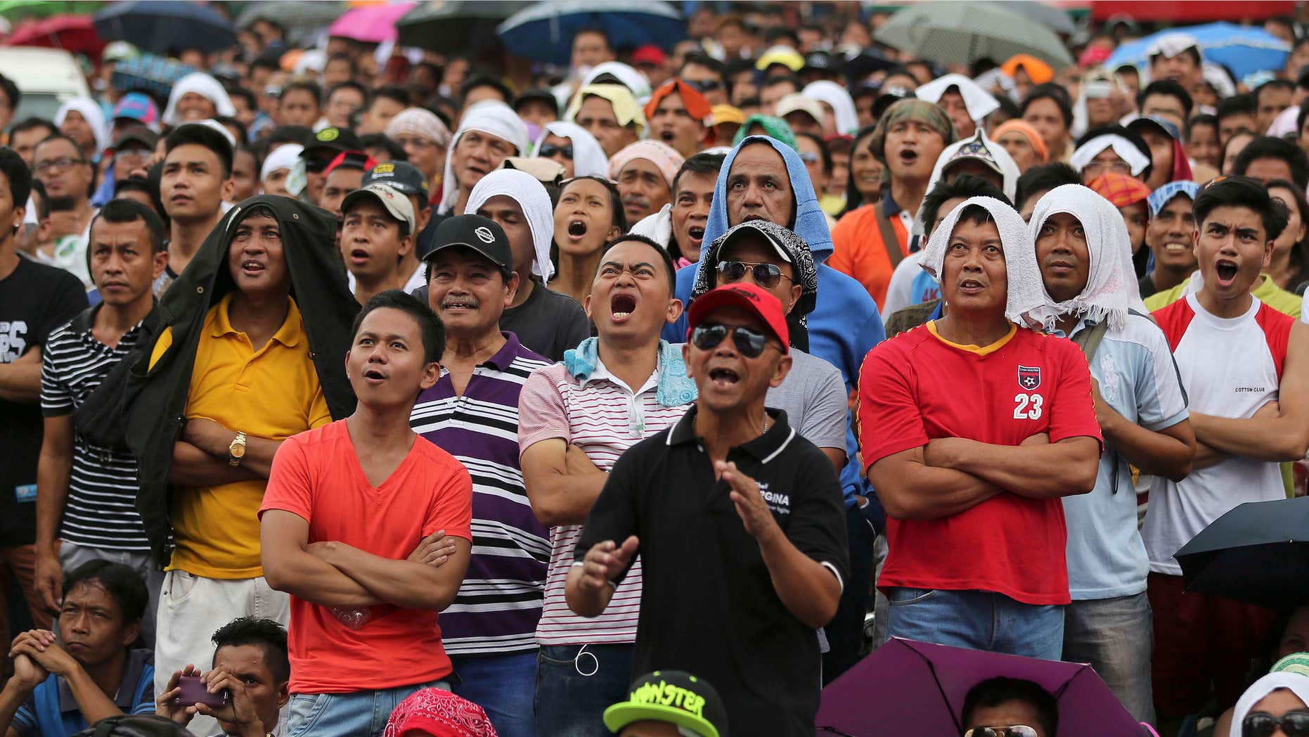 May 3, 2015: Filipinos watch a live satellite feed of the welterweight title fight between Filipino boxing hero Manny Pacquiao and Floyd Mayweather Jr. during a free public viewing in downtown Manila, Philippines.