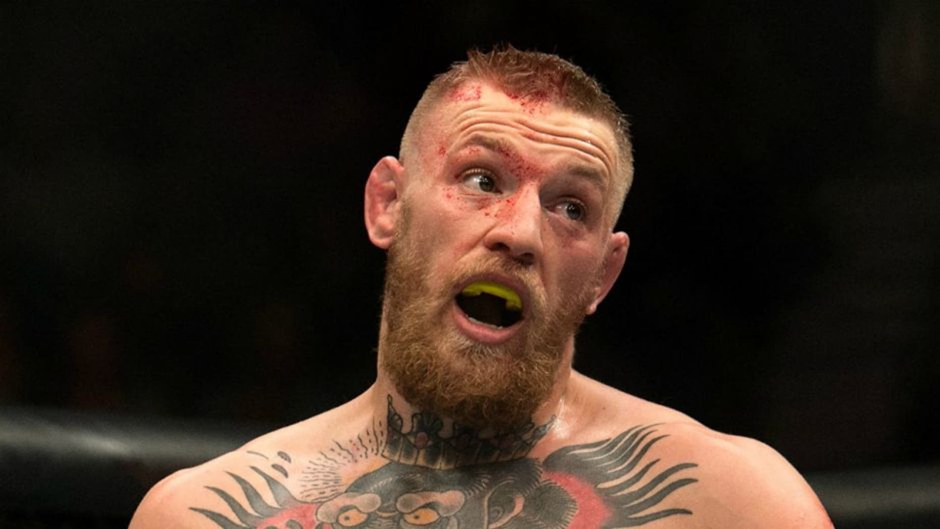 LAS VEGAS, NV - MARCH 5: Conor McGregor mocks Nate Diaz in their welterweight bout during the UFC 196 in the MGM Grand Garden Arena on March 5, 2016 in Las Vegas, Nevada. (Photo by Brandon Magnus/Zuffa LLC/Zuffa LLC via Getty Images)