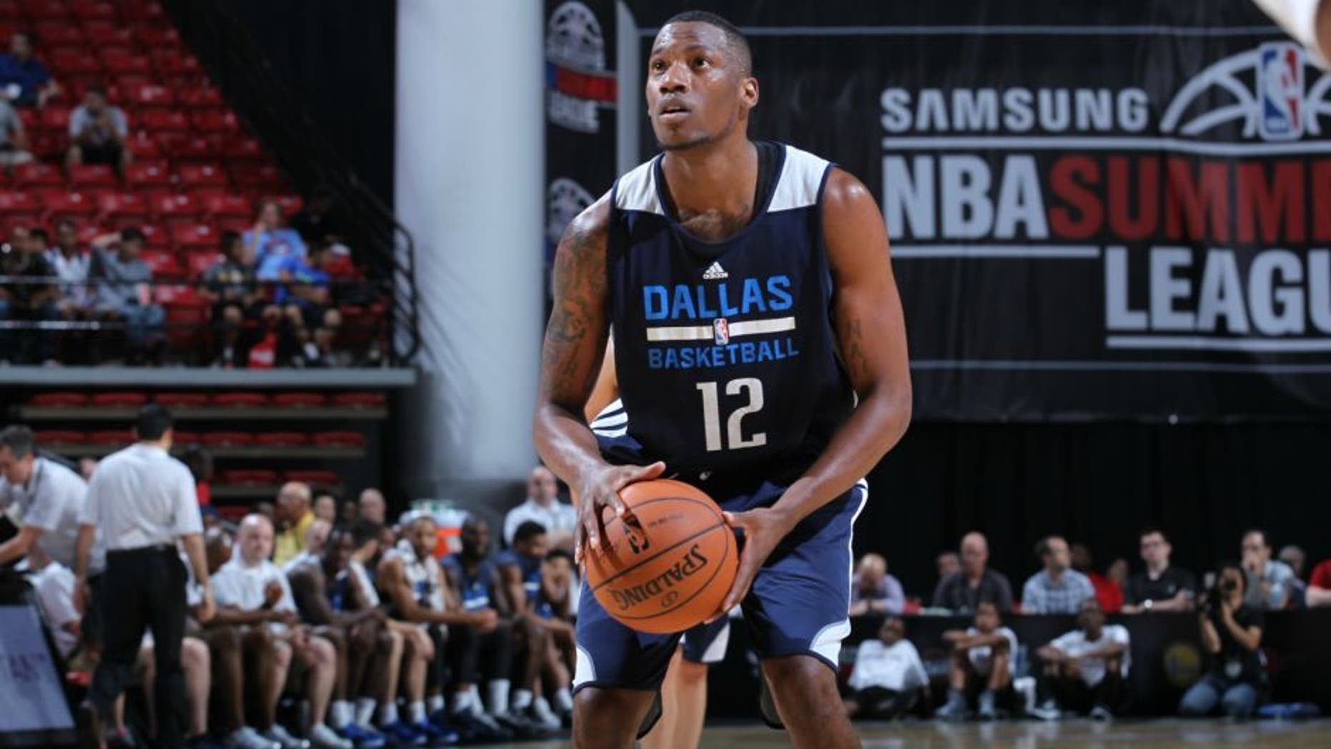 LAS VEGAS, NV - JULY 12: Eric Griffin #12 of the Dallas Mavericks shoots a free throw against the Minnesota Timberwolves during the game on July 12, 2014 at the Thomas & Mack Center in Las Vegas, Nevada. NOTE TO USER: User expressly acknowledges and agrees that, by downloading and or using this photograph, User is consenting to the terms and conditions of the Getty Images License Agreement. Mandatory Copyright Notice: Copyright 2014 NBAE (Photo by Jack Arent/NBAE via Getty Images)