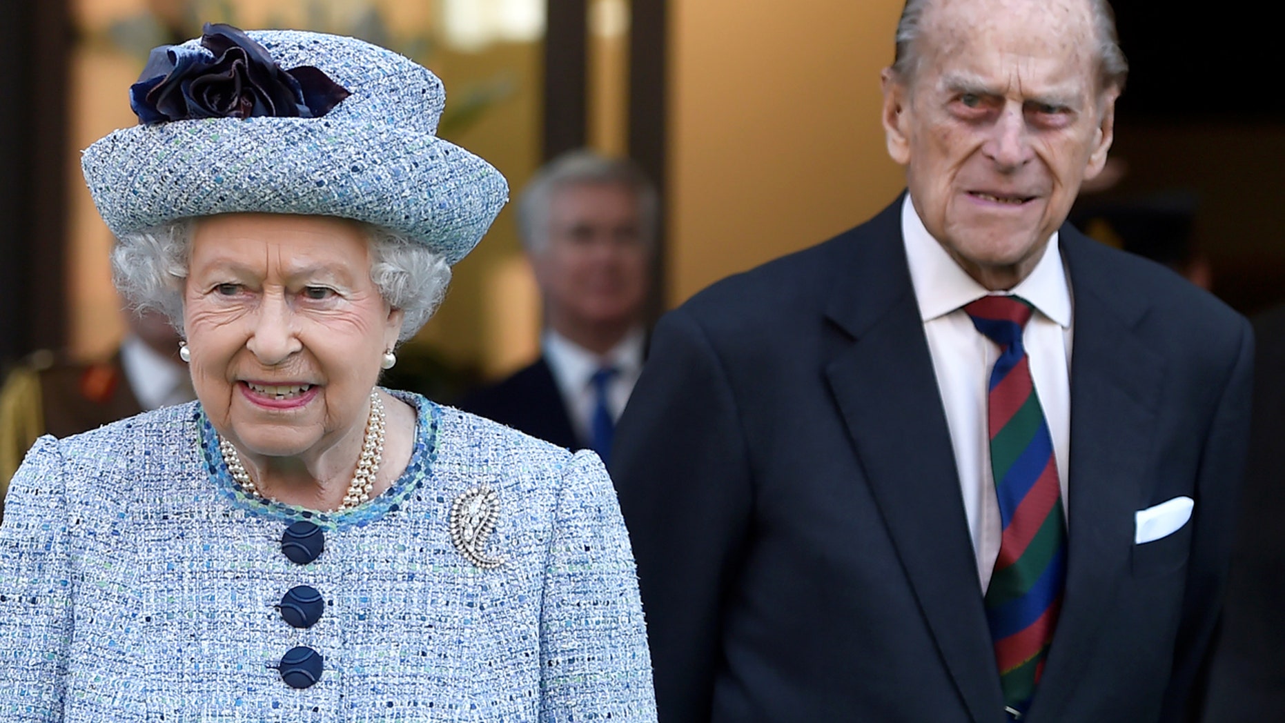Britain's Queen Elizabeth II and Prince Philip, the Duke of Edinburgh leave the National Army Museum in London, Britain March 16, 2017. REUTERS/Hannah McKay - RTX31AH1