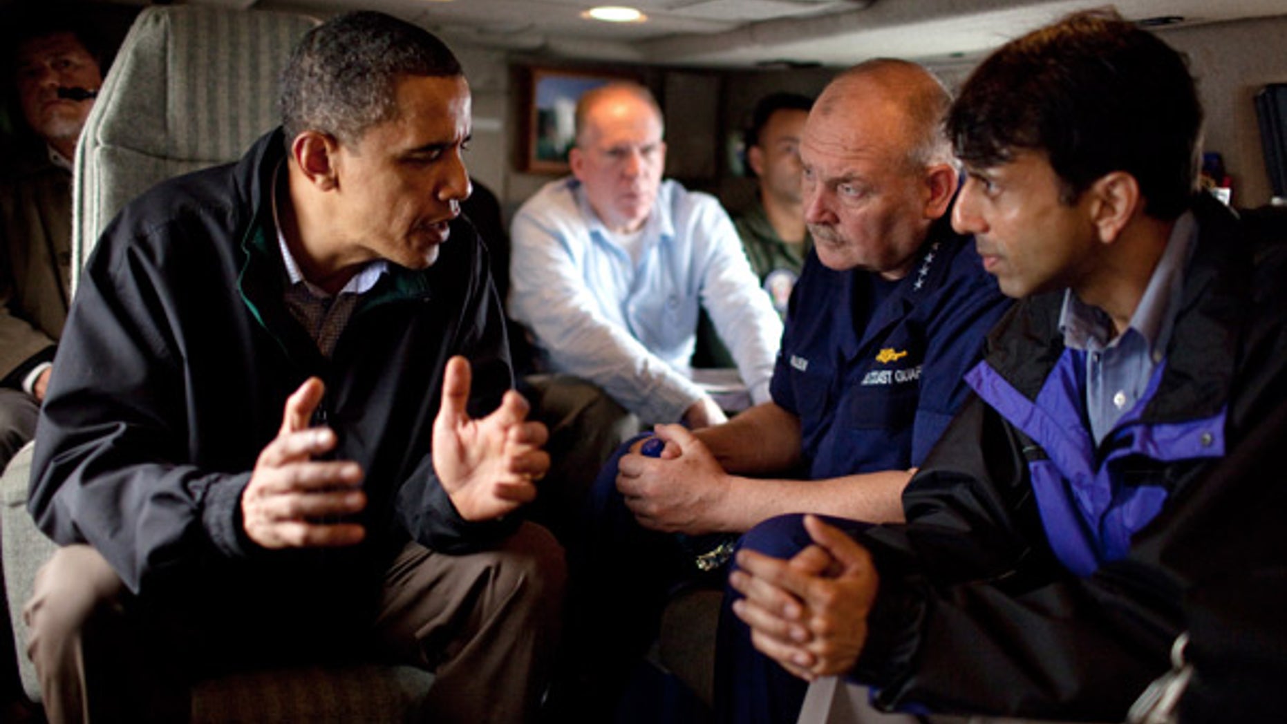 FILE: President Obama talks with U.S. Coast Guard Commandant Adm. Thad Allen and Louisiana Gov. Bobby Jindal aboard Marine One on May 2 as they fly along the coastline from Venice, La.