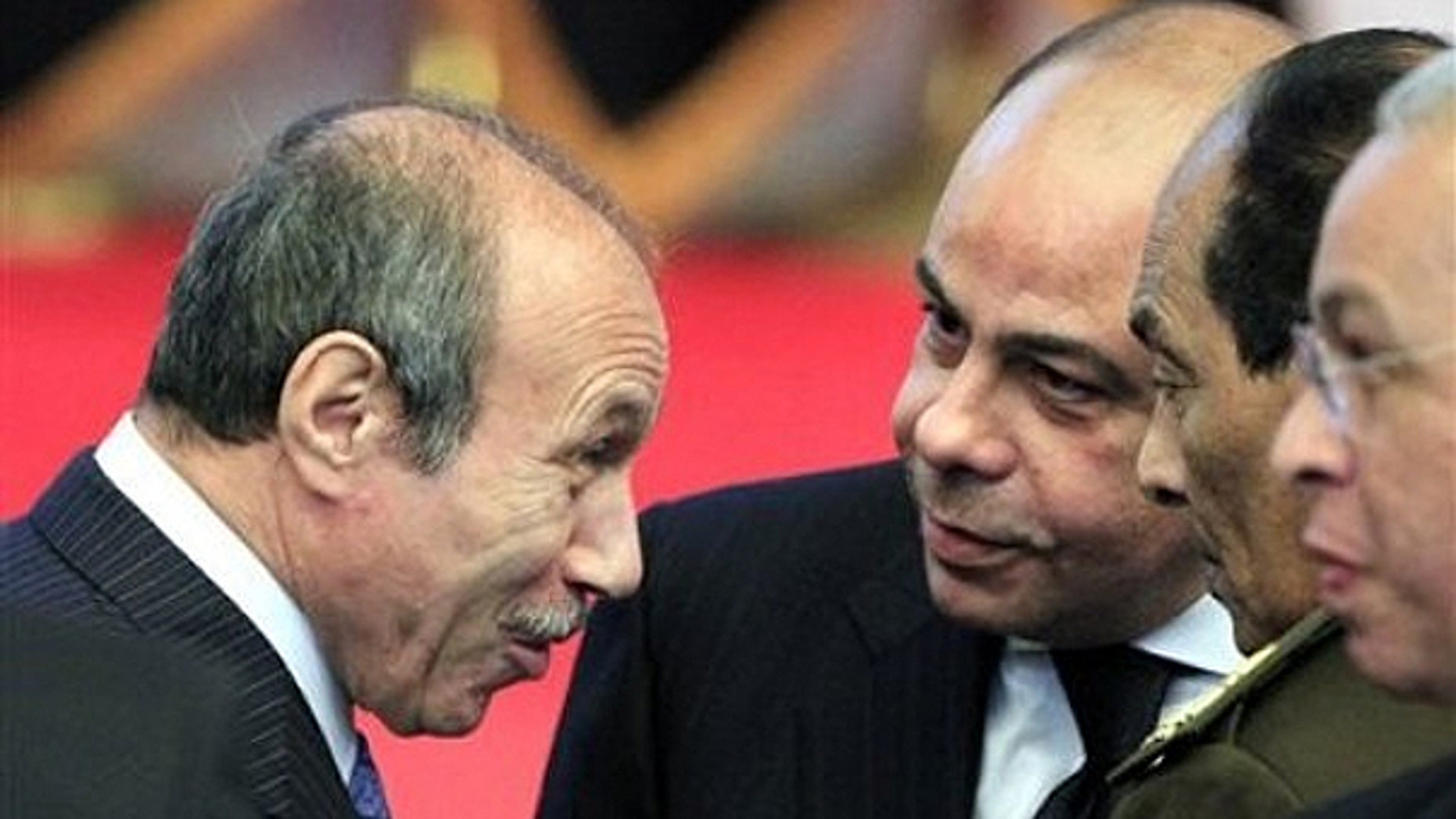 Egyptian Interior Minister Habib al-Adly, left, talks to minister of defense and military production, Field Marshal Hussein Tantawi, second right, during the National democratic party conference in Cairo, Egypt, in this Saturday Dec. 25, 2010 file photo.
