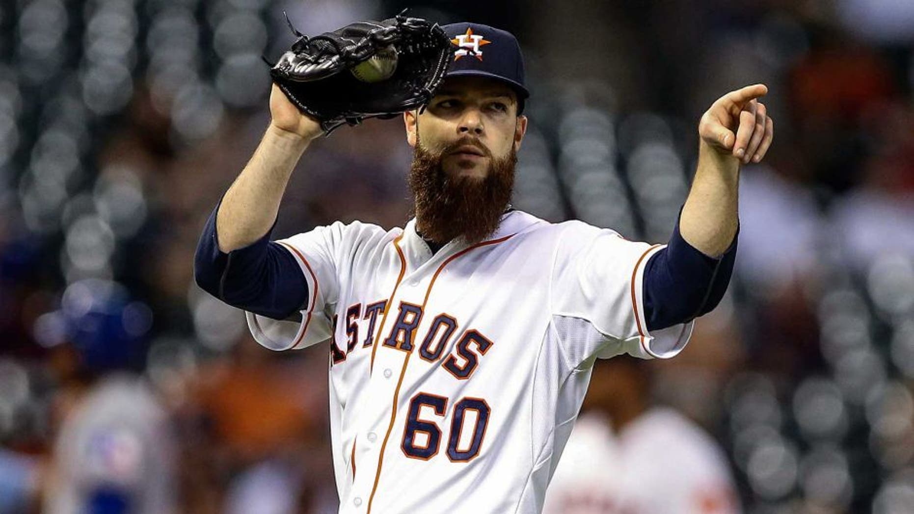 May 4, 2015; Houston, TX, USA; Houston Astros starting pitcher Dallas Keuchel (60) points to first baseman Chris Carter (not pictured) after a play during the fifth inning against the Texas Rangers at Minute Maid Park. Mandatory Credit: Troy Taormina-USA TODAY Sports