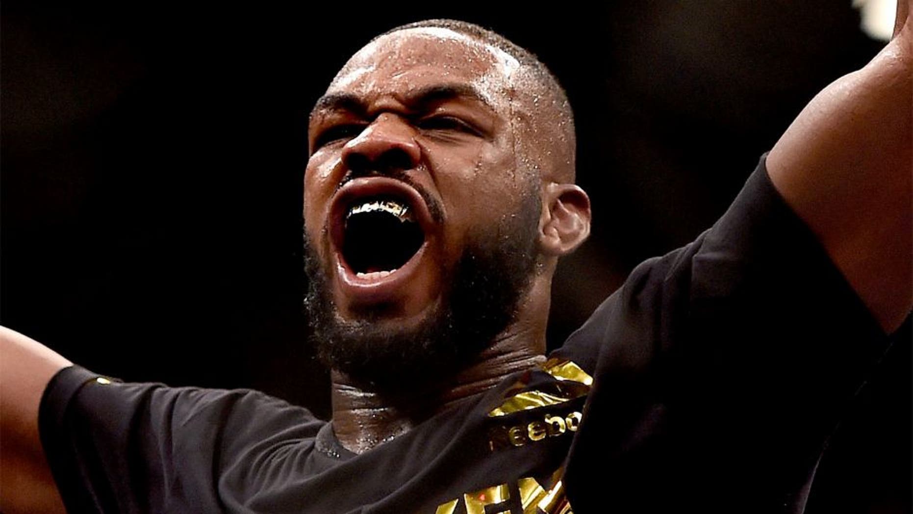 LAS VEGAS, NV - JANUARY 03: Jon Jones celebrates after defeating Daniel Cormier in their UFC light heavyweight championship bout during the UFC 182 event at the MGM Grand Garden Arena on January 3, 2015 in Las Vegas, Nevada. (Photo by Jeff Bottari/Zuffa LLC/Zuffa LLC via Getty Images)
