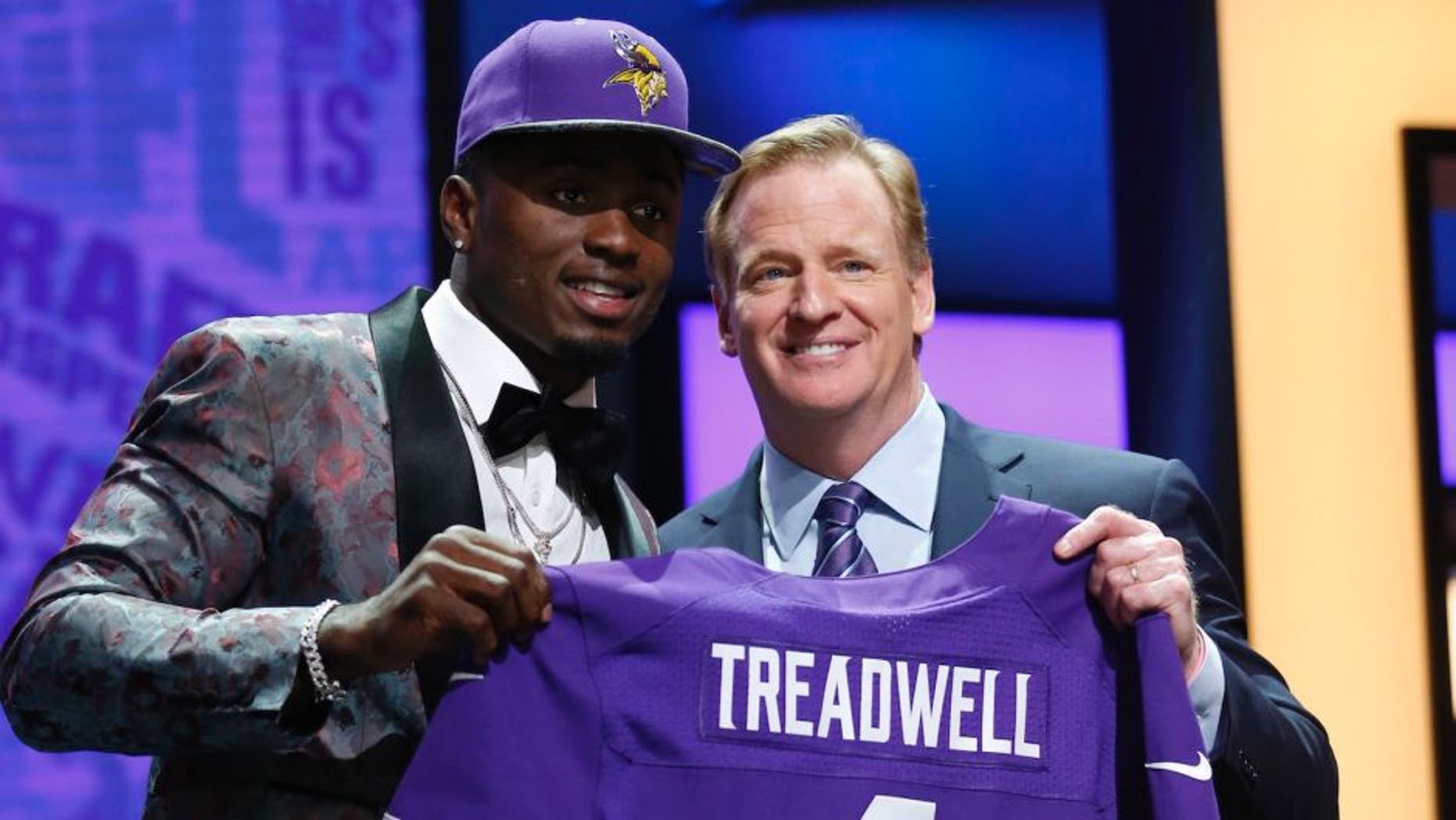 Apr 28, 2016; Chicago, IL, USA; Laquon Treadwell (Mississippi) with NFL commissioner Roger Goodell after being selected by the Minnesota Vikings as the number twenty-three overall pick in the first round of the 2016 NFL Draft at Auditorium Theatre. Mandatory Credit: Kamil Krzaczynski-USA TODAY Sports