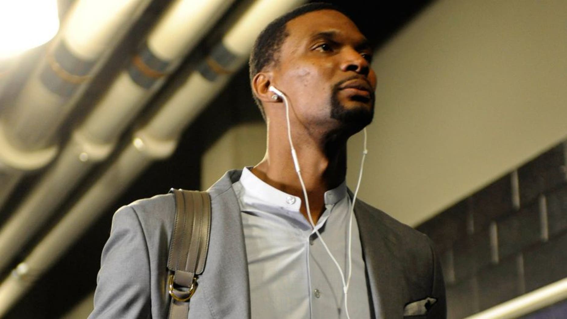 Apr 29, 2016; Charlotte, NC, USA; Miami Heat forward Chris Bosh (1) arrives to to the arena before game six of the first round of the NBA Playoffs against the Charlotte Hornets at Time Warner Cable Arena. Mandatory Credit: Sam Sharpe-USA TODAY Sports