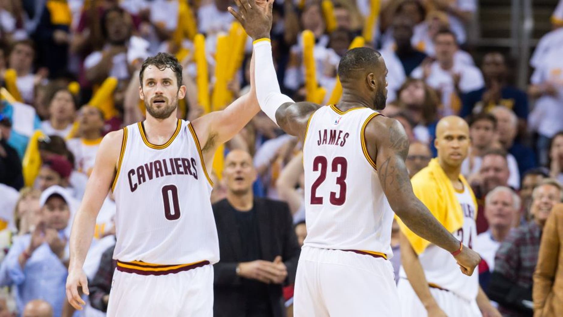 CLEVELAND, OH - APRIL 17: Kevin Love #0 of the Cleveland Cavaliers and LeBron James #23 celebrate during the second half of the NBA Eastern Conference quarterfinals against the Detroit Pistons at Quicken Loans Arena on April 17, 2016 in Cleveland, Ohio. The Cavaliers defeated the Pistons 106-101. NOTE TO USER: User expressly acknowledges and agrees that, by downloading and or using this photograph, User is consenting to the terms and conditions of the Getty Images License Agreement. (Photo by Jason Miller/Getty Images)
