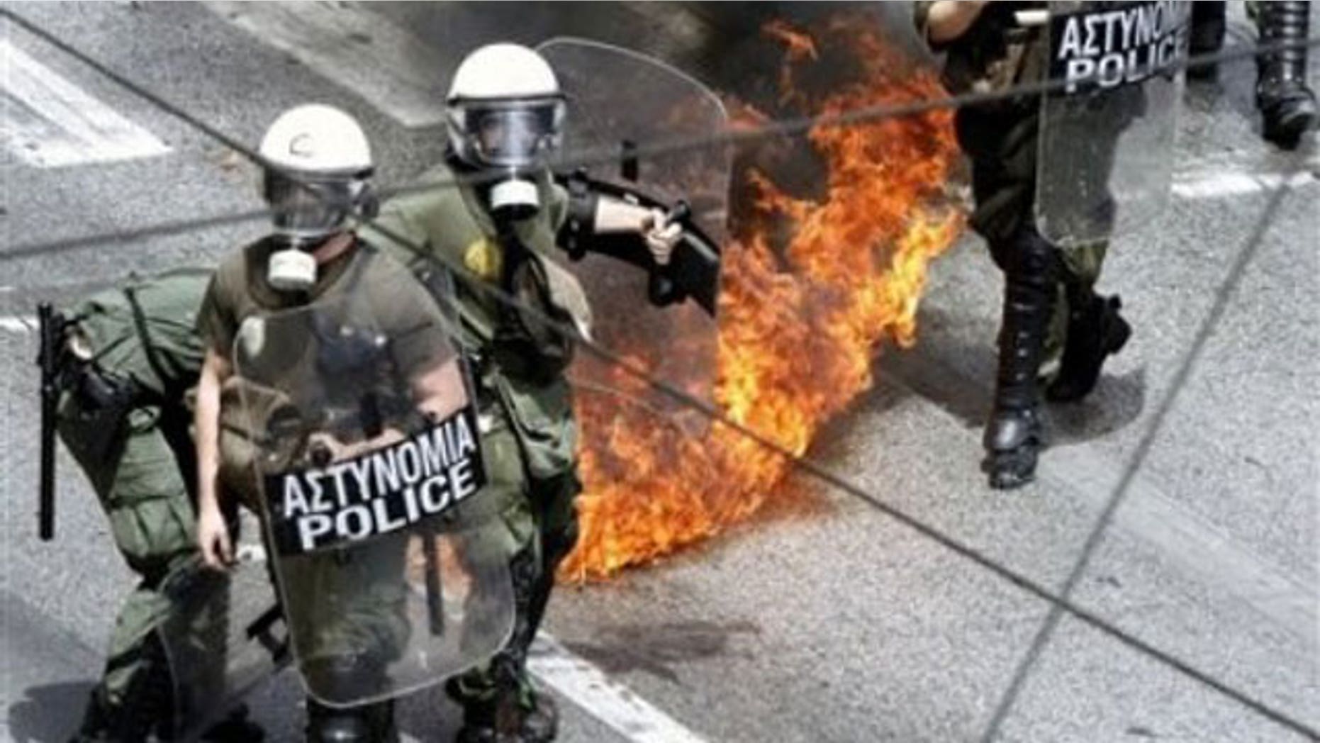 May 5: A petrol bomb expodes near riot police during an anti-government rally in Athens.