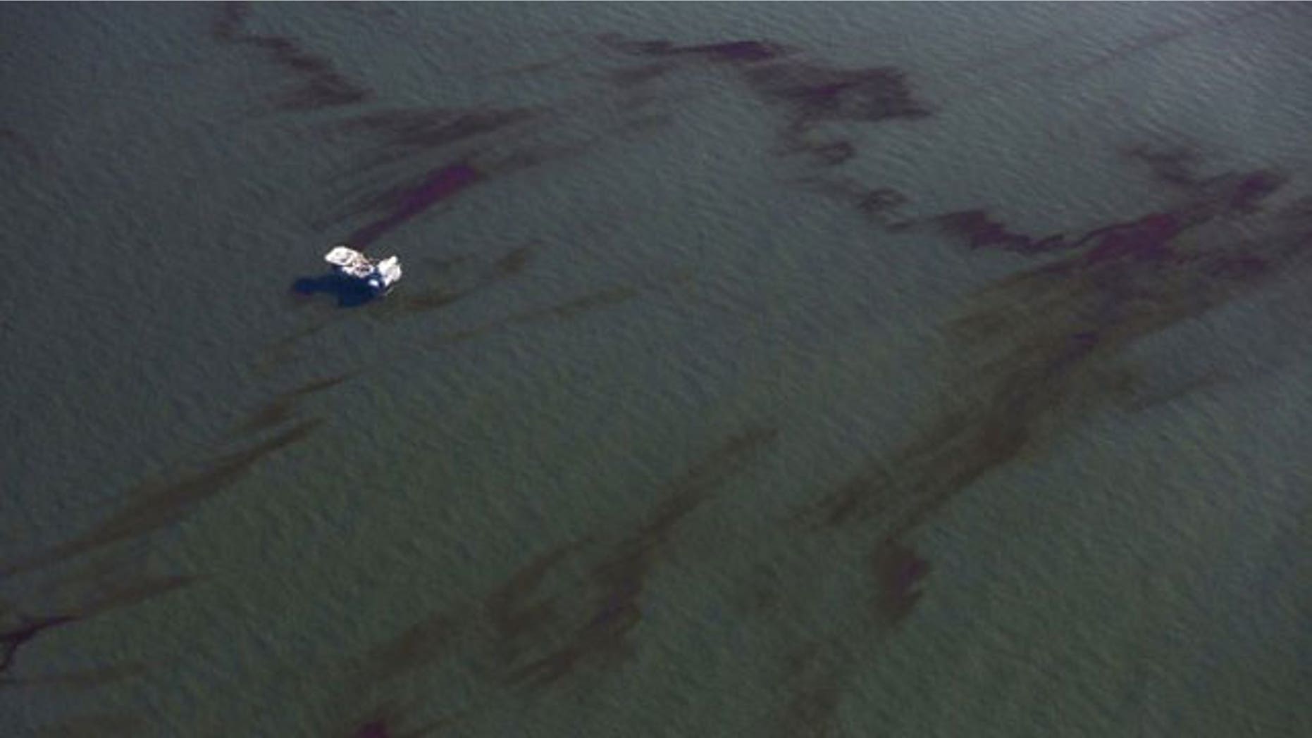 May 5: A platform is surrounded by the oil spill from the Deepwater Horizon wellhead at the mouth of the Mississippi River.