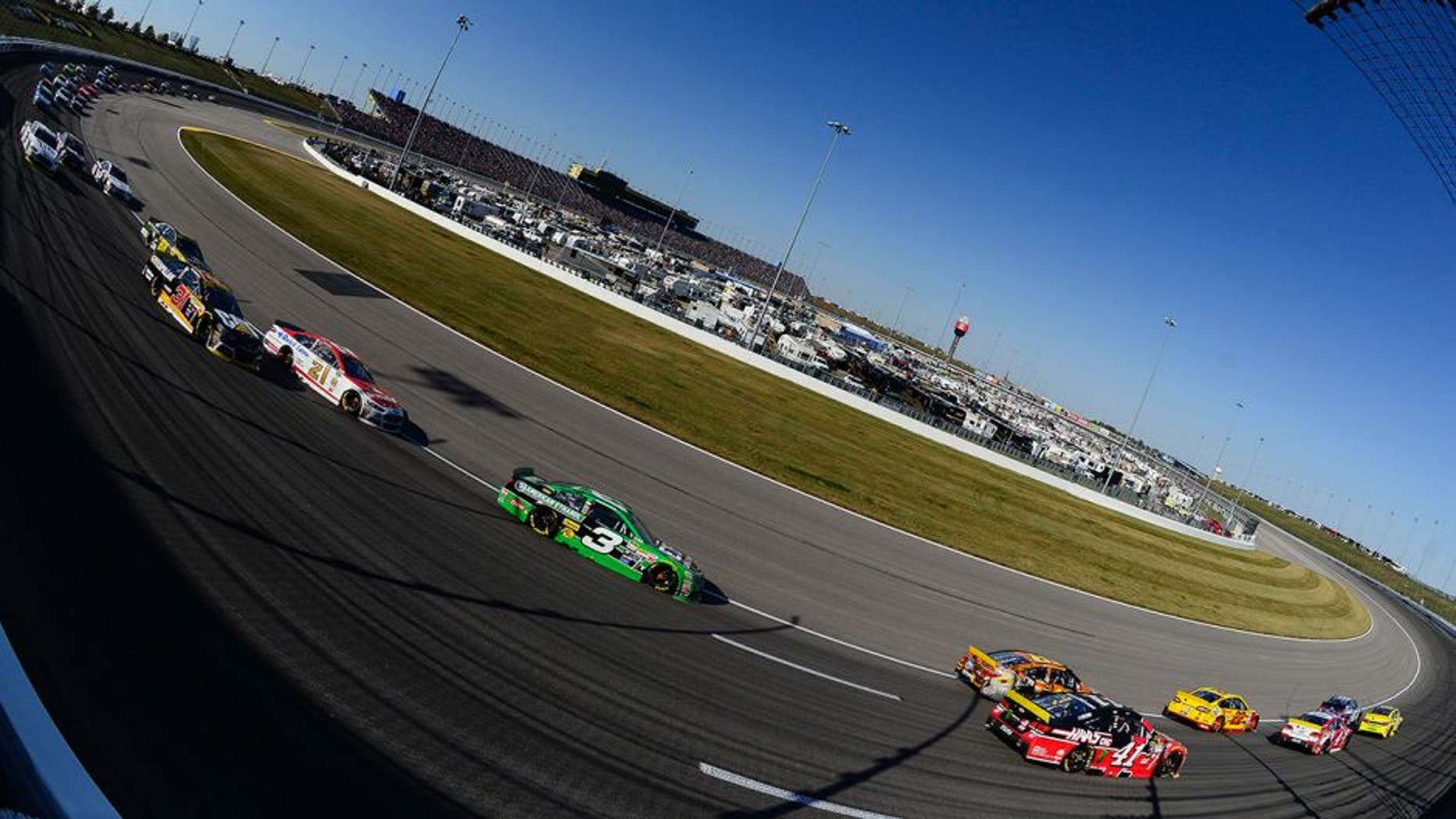 Drivers race during the NASCAR Sprint Cup Series Hollywood Casino 400 at Kansas Speedway on October 18, 2015 in Kansas City, Kansas.