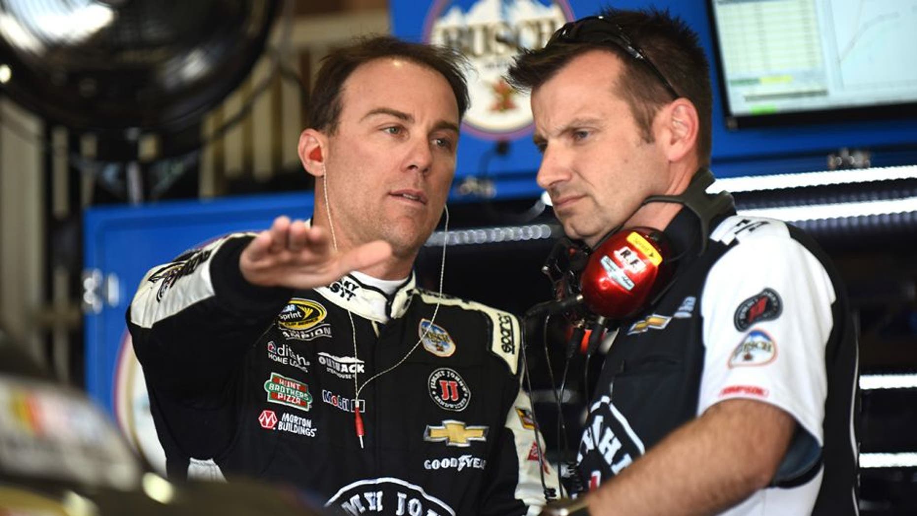 FONTANA, CA - MARCH 18: Kevin Harvick, driver of the #4 Jimmy John's Chevrolet, talks to his crew chief, Rodney Childers, during practice for the NASCAR Sprint Cup Series Auto Club 400 at Auto Club Speedway on March 18, 2016 in Fontana, California. (Photo by Jonathan Moore/Getty Images)