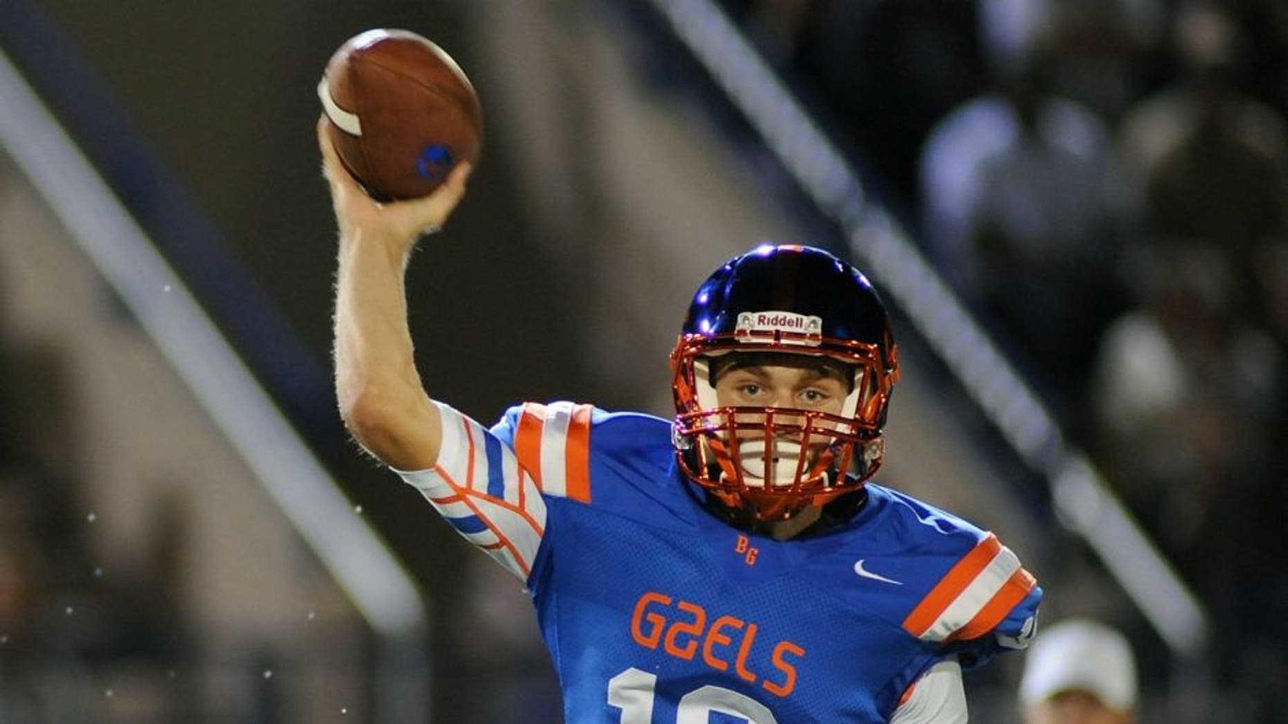 Sep 26, 2014; Las Vegas, NV, USA; Bishop Gorman Gaels quarterback Tate Martell (18) looks to pass the ball during a game against St. John Bosco High School at Fertitta Field. Bishop Gorman won the game 34-31. Mandatory Credit: Stephen R. Sylvanie-USA TODAY Sports