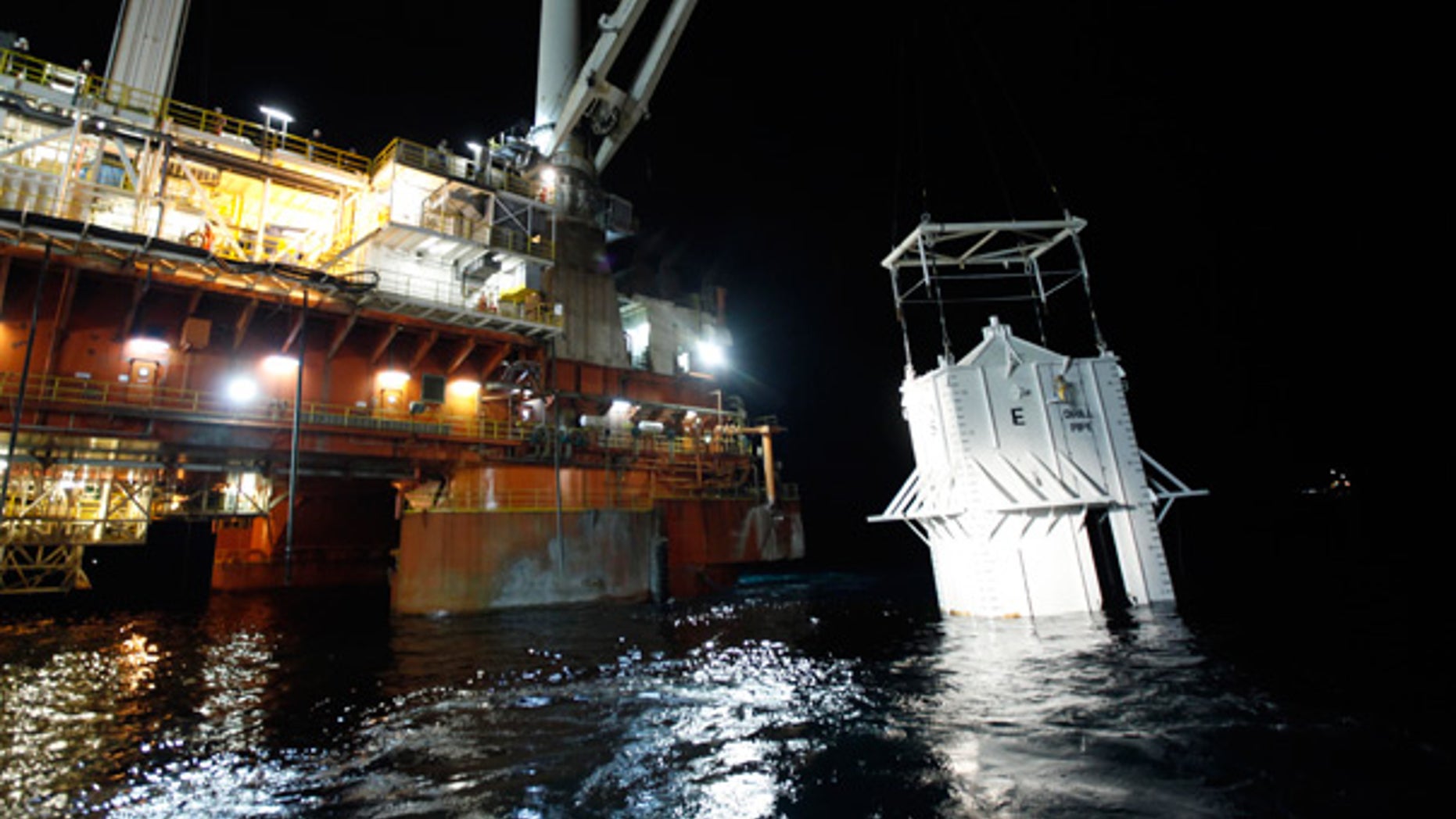 May 6: The oil containment box is lowered into the Gulf at the site of the Deepwater Horizon rig collapse.