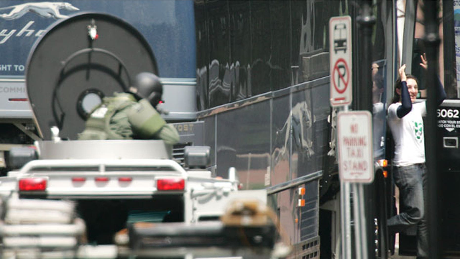 May 6: A hostage, right, is released during a bomb threat aboard a bus which cleared much of downtown Portsmouth, N.H.