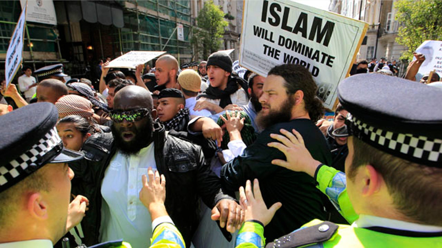 May 6: Police officers try to restrain pro-bin Laden supporters, marching to the U.S. Embassy in London to protest against the killing of Al Qaeda leader Usama Bin Laden.
