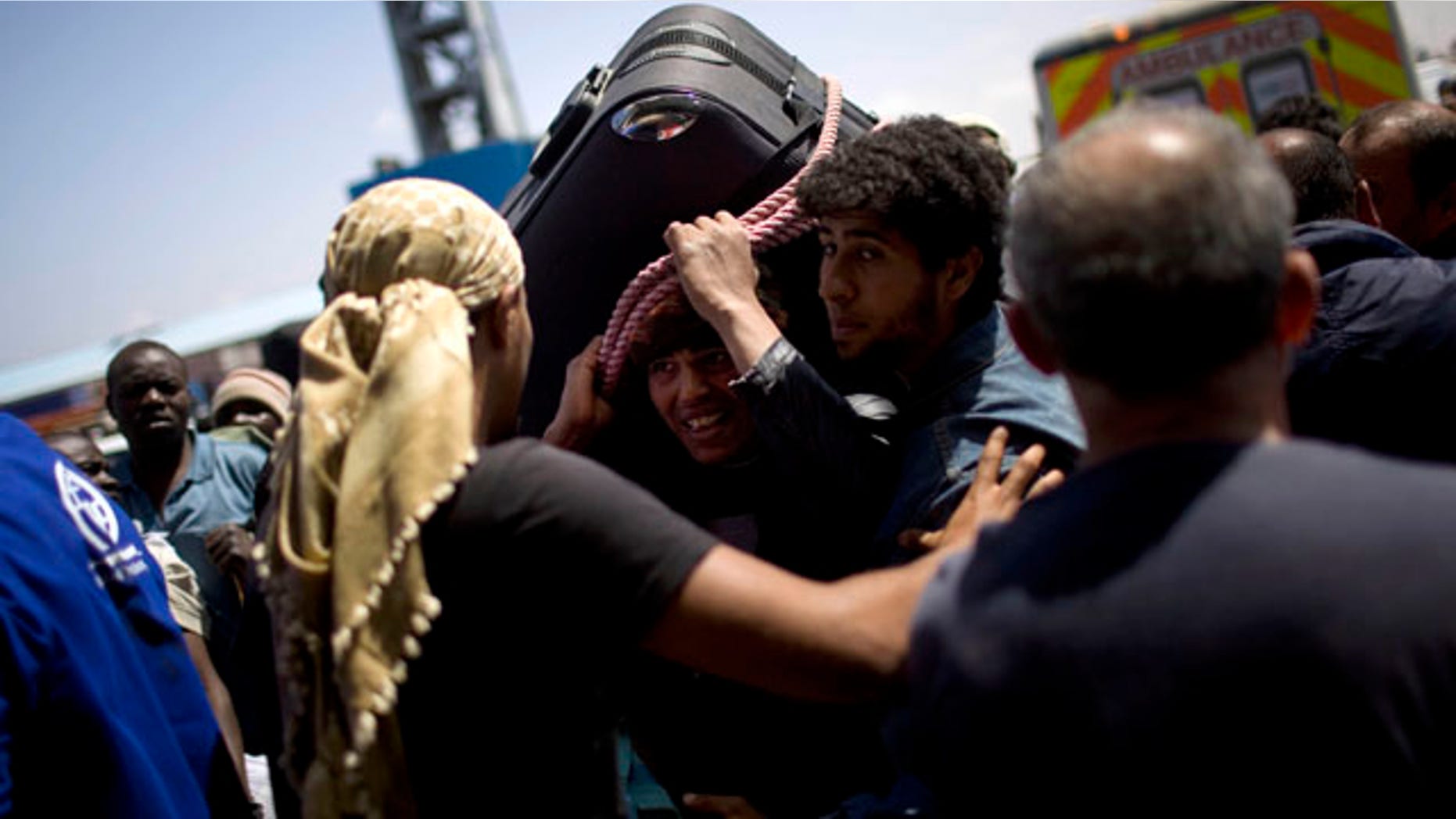 May 4: A Libyan man, center, tries to leave from the besieged city of Misrata, Libya.