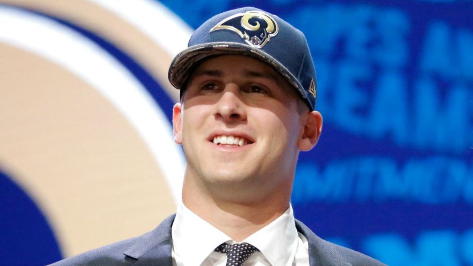 during the first round of the 2016 NFL Draft at the Auditorium Theatre of Roosevelt University on April 28, 2016 in Chicago, Illinois.,CHICAGO, IL - APRIL 28: (L-R) Jared Goff of the California Golden Bears holds up a jersey with NFL Commissioner Roger Goodell after being picked #1 overall by the Los Angeles Rams during the first round of the 2016 NFL Draft at the Auditorium Theatre of Roosevelt University on April 28, 2016 in Chicago, Illinois. (Photo by Jon Durr/Getty Images)
