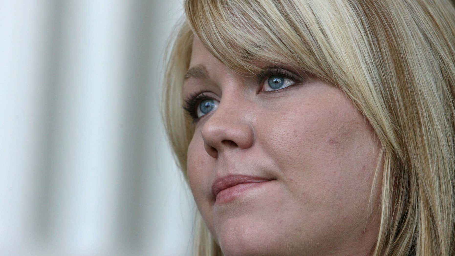 July 27, 2010: Elissa Wall talks with reporters at the Matheson courthouse in Salt Lake City, about the Utah Supreme Court ordering a new trial for polygamous leader Warren Jeffs.