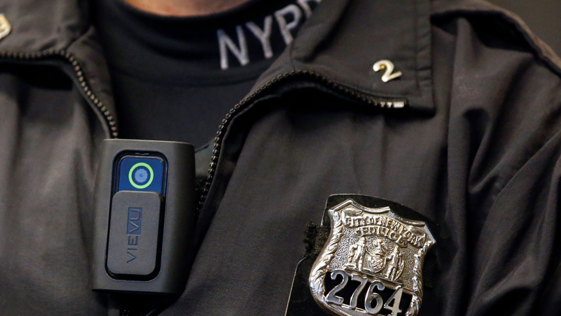 FILE PHOTO - A police body camera is seen on an officer during a news conference on the pilot program of body cameras involving 60 NYPD officers dubbed 'Big Brother' at the NYPD police academy in the Queens borough of New York, December 3, 2014. REUTERS/Shannon Stapleton/File Photo - RTX2Z30U