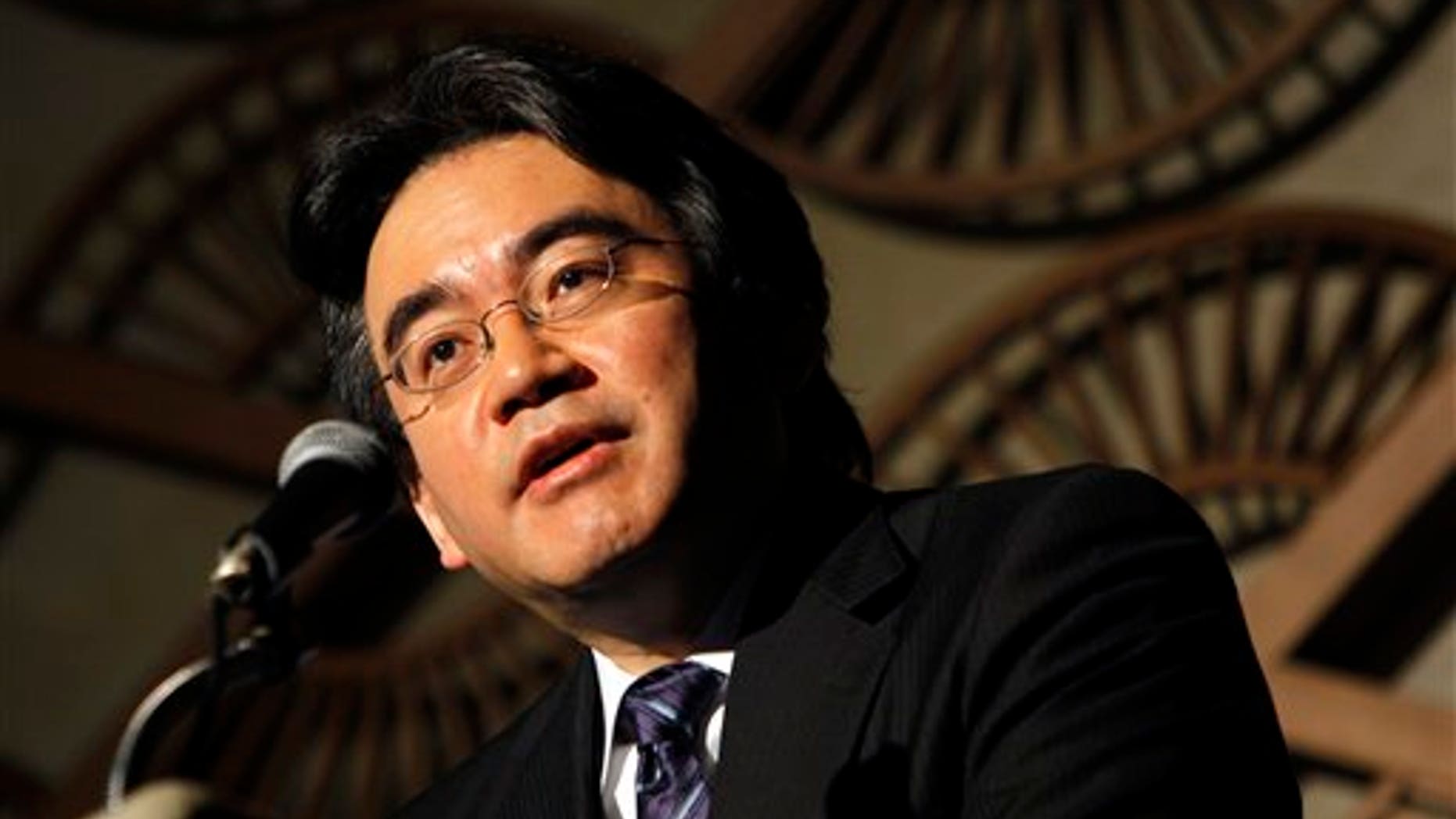 May 7: Nintendo Co. President Satoru Iwata speaks during a press briefing in Tokyo. Iwata said anti-piracy measures will be beefed up in its upcoming 3-D handheld gaming device. The Japanese game-maker of Super Mario and Pokemon has said it will unveil the new device at the E3 trade show in Los Angeles next month.