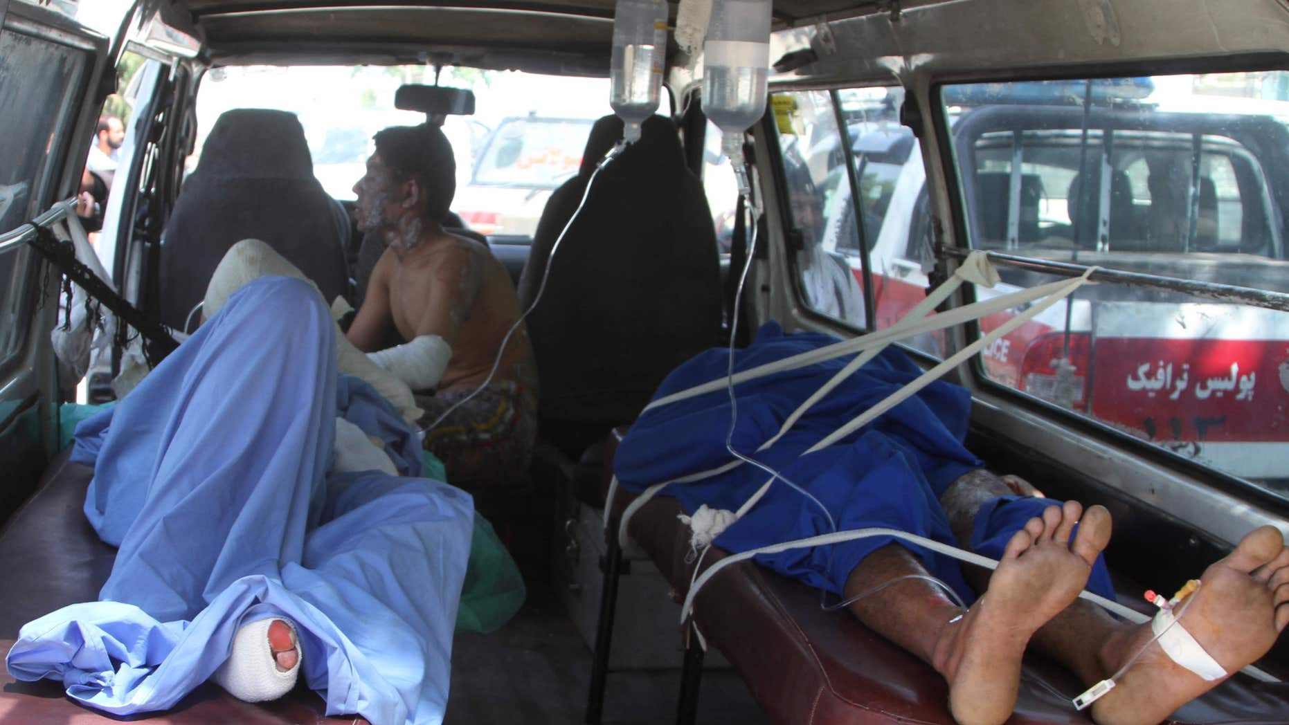 May 8, 2016: Injured Afghan men lie in an ambulance after an accident on the main highway linking the capital, Kabul, to the southern city of Kandahar, in Ghazni province eastern of Kabul, Afghanistan.