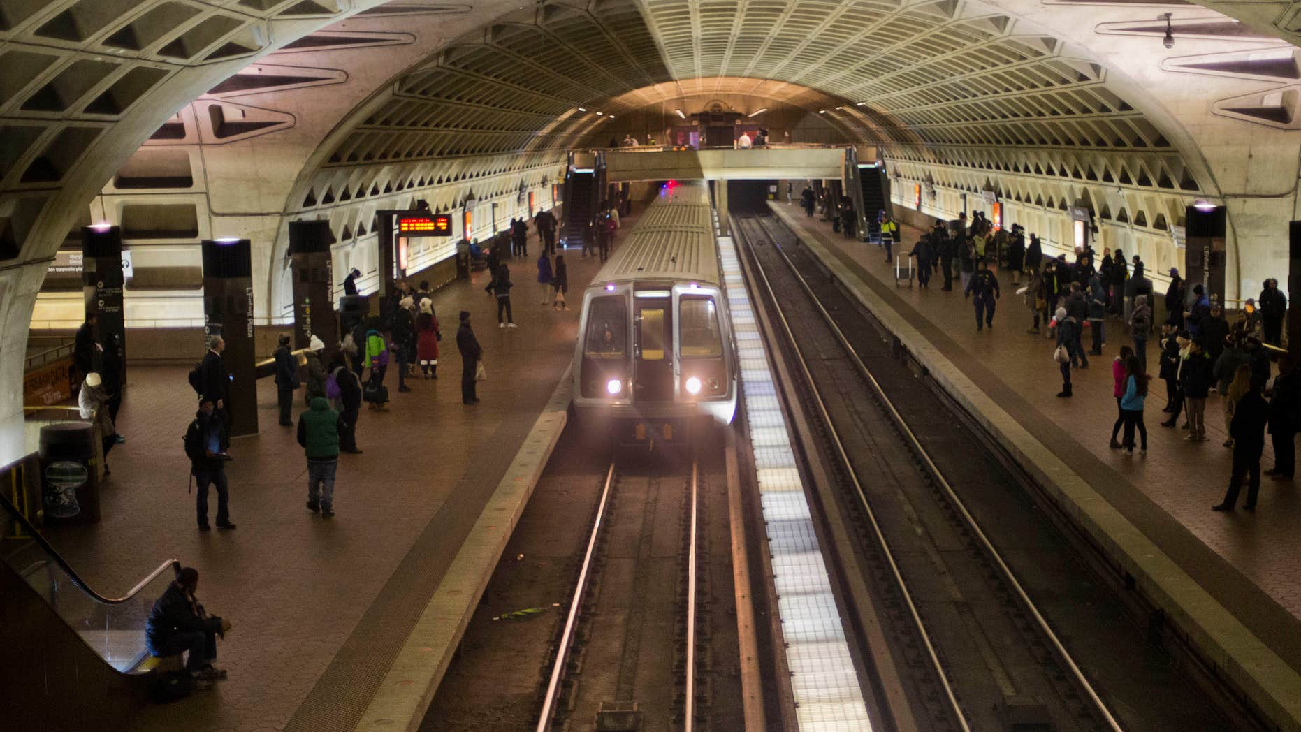 FILE - In this Jan. 13, 2015 file photo, a subway train arrives at the L'Enfant Metro Station in Washington.
