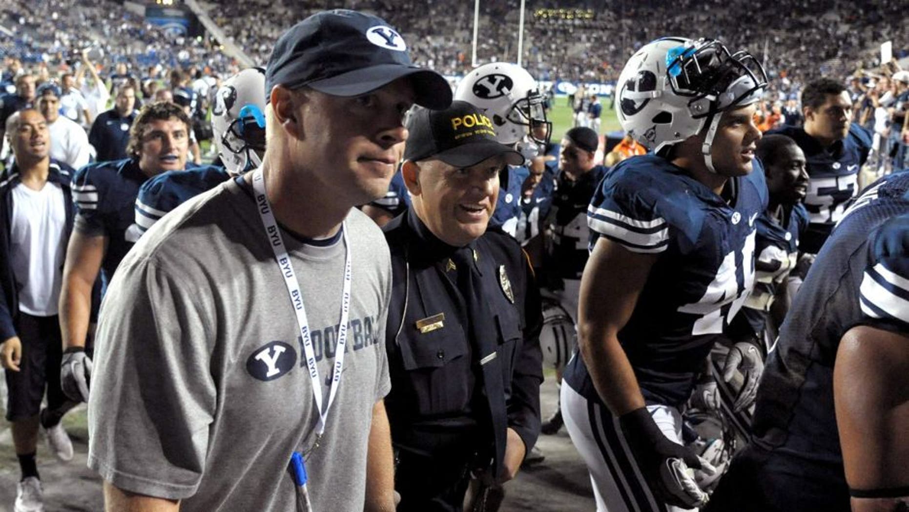 Sep 23, 2011; Provo, UT, USA; BYU Cougars coach Bronco Mendenhall walks off the field after the game against the UCF Knights at LaVell Edwards Stadium. BYU defeated UCF 24-17. Mandatory Credit: Kirby Lee/Image of Sport-USA TODAY Sports