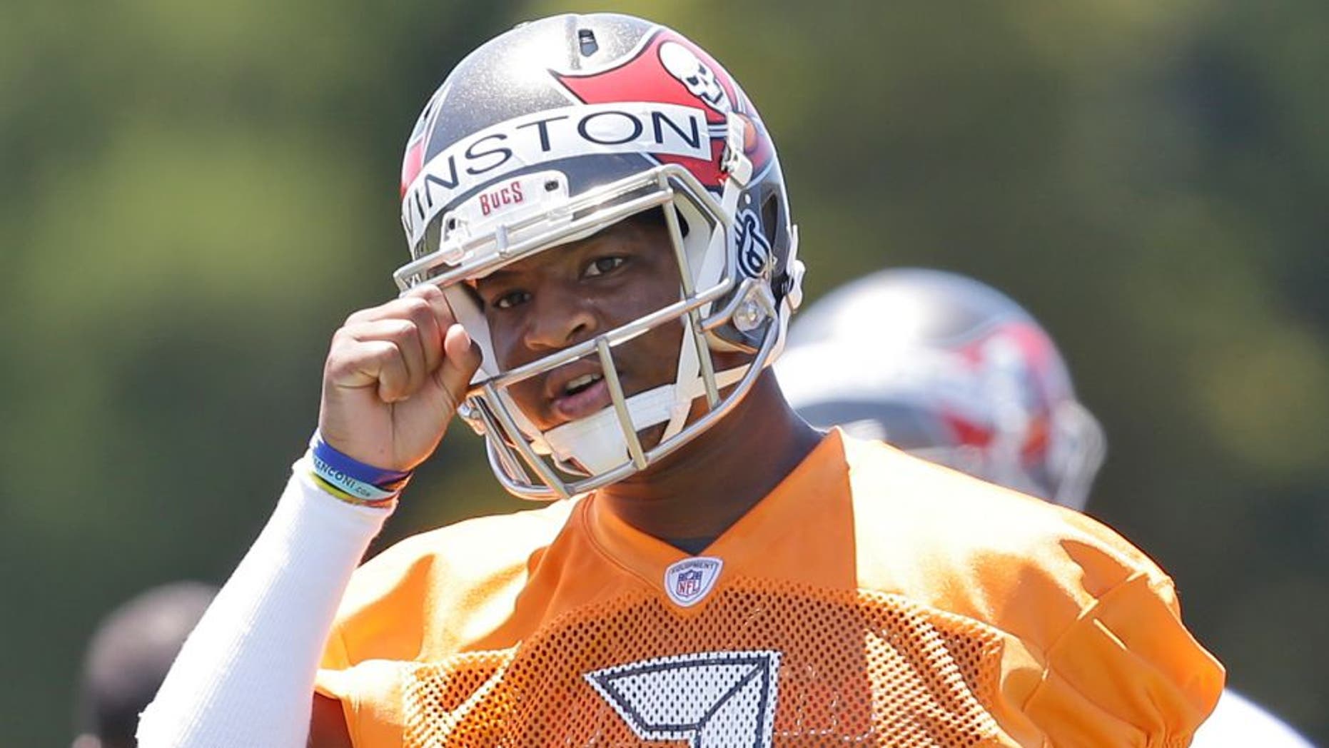 Tampa Bay Buccaneers quarterback Jameis Winston calls out a play during drills in an NFL rookie minicamp in Tampa, Fla., Friday, May 8, 2015. (AP Photo/Wilfredo Lee)