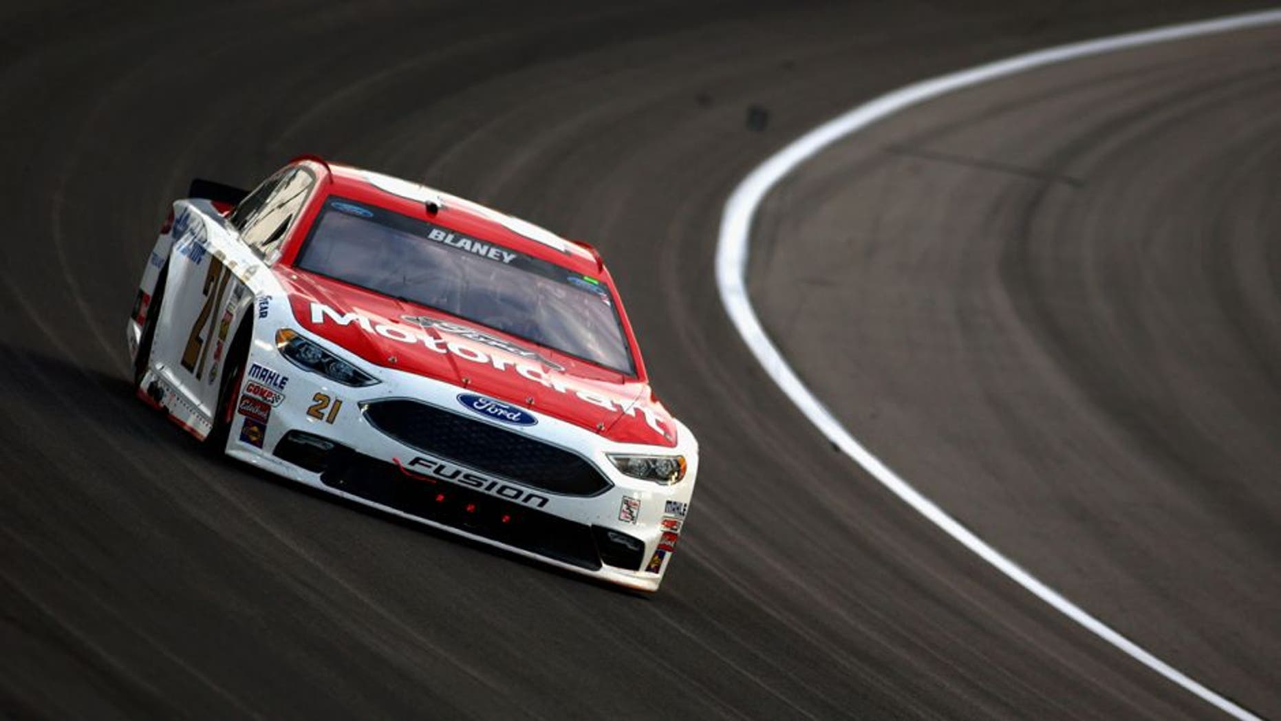 KANSAS CITY, KS - MAY 07: Ryan Blaney, driver of the #21 Motorcraft/Quick Lane Tire & Auto Center Ford, races during the NASCAR Sprint Cup Series Go Bowling 400 at Kansas Speedway on May 7, 2016 in Kansas City, Kansas. (Photo by Jamie Squire/Getty Images)