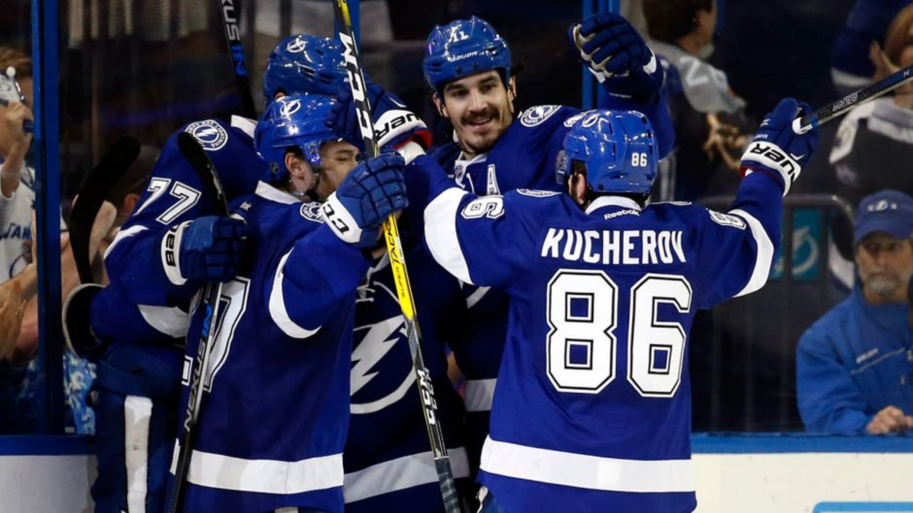 May 8, 2016; Tampa, FL, USA; Tampa Bay Lightning defenseman Victor Hedman (77) is congratulated by right wing Nikita Kucherov (86) and teammates after scored a goal against the New York Islanders during the second period in game five of the second round of the 2016 Stanley Cup Playoffs at Amalie Arena. Mandatory Credit: Kim Klement-USA TODAY Sports