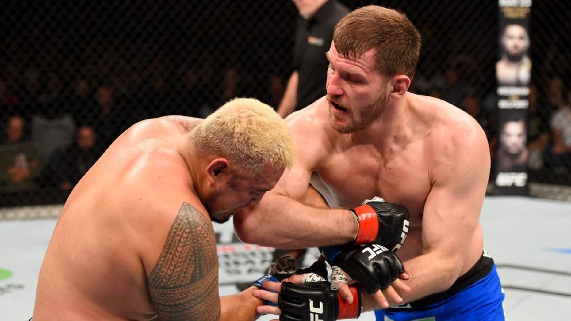 ADELAIDE, AUSTRALIA - MAY 10: (R-L) Stipe Miocic elbows Mark Hunt in their heavyweight bout during the UFC Fight Night event at the Adelaide Entertainment Centre on May 10, 2015 in Adelaide, Australia. (Photo by Josh Hedges/Zuffa LLC/Zuffa LLC via Getty Images)