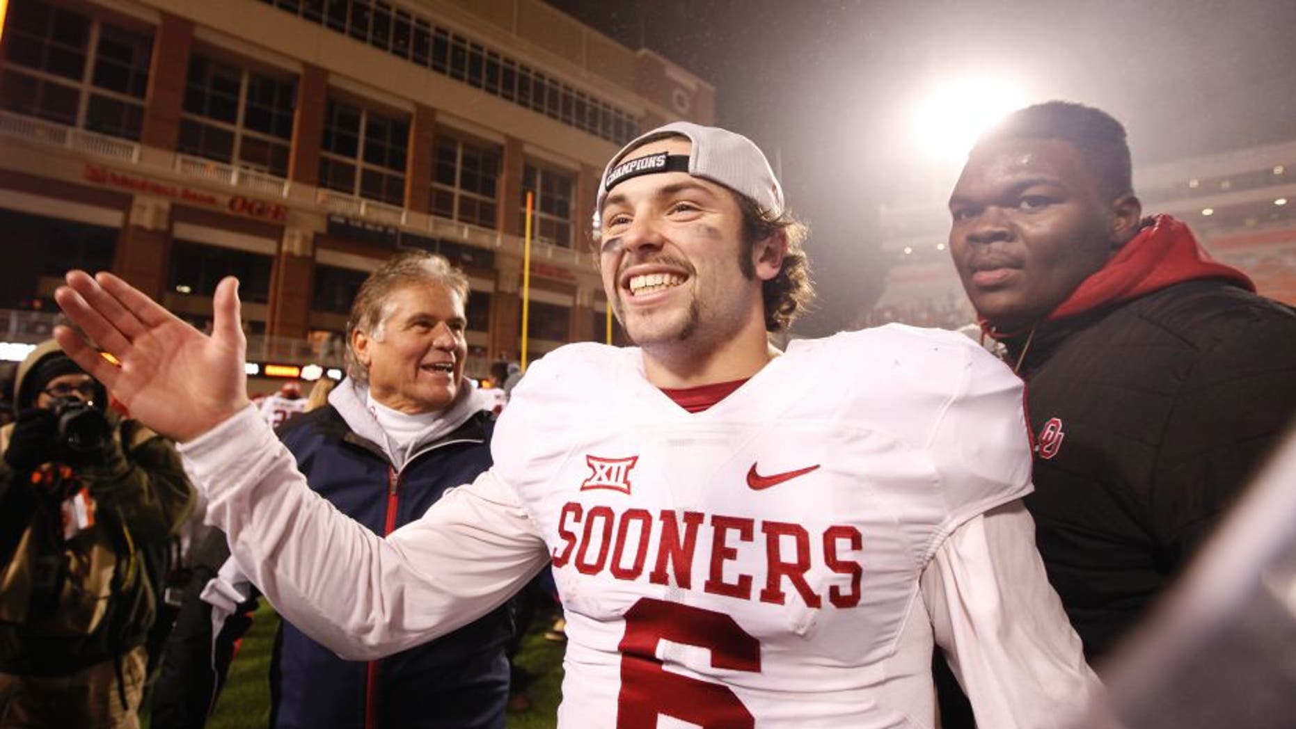 STILLWATER, OK - NOVEMBER 28 : Quarterback Baker Mayfield #6 of the Oklahoma Sooners celebrates after the game against the Oklahoma State Cowboys November 28, 2015 at Boone Pickens Stadium in Stillwater, Oklahoma. Oklahoma defeated Oklahoma State 58-23.(Photo by Brett Deering/Getty Images)
