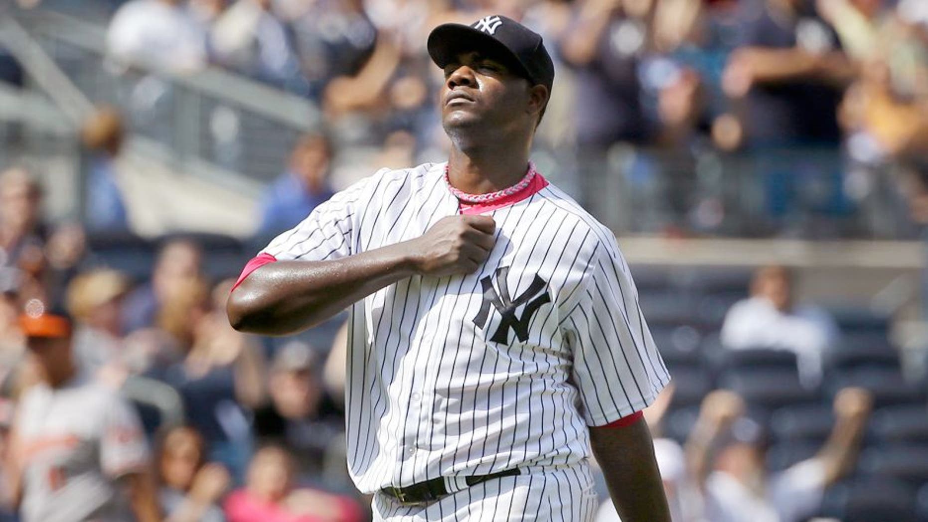 New York Yankees starting pitcher Michael Pineda reacts after striking out Baltimore Orioles' Ryan Flaherty during the seventh inning of the baseball game at Yankee Stadium, Sunday, May 10, 2015, in New York. (AP Photo/Seth Wenig)