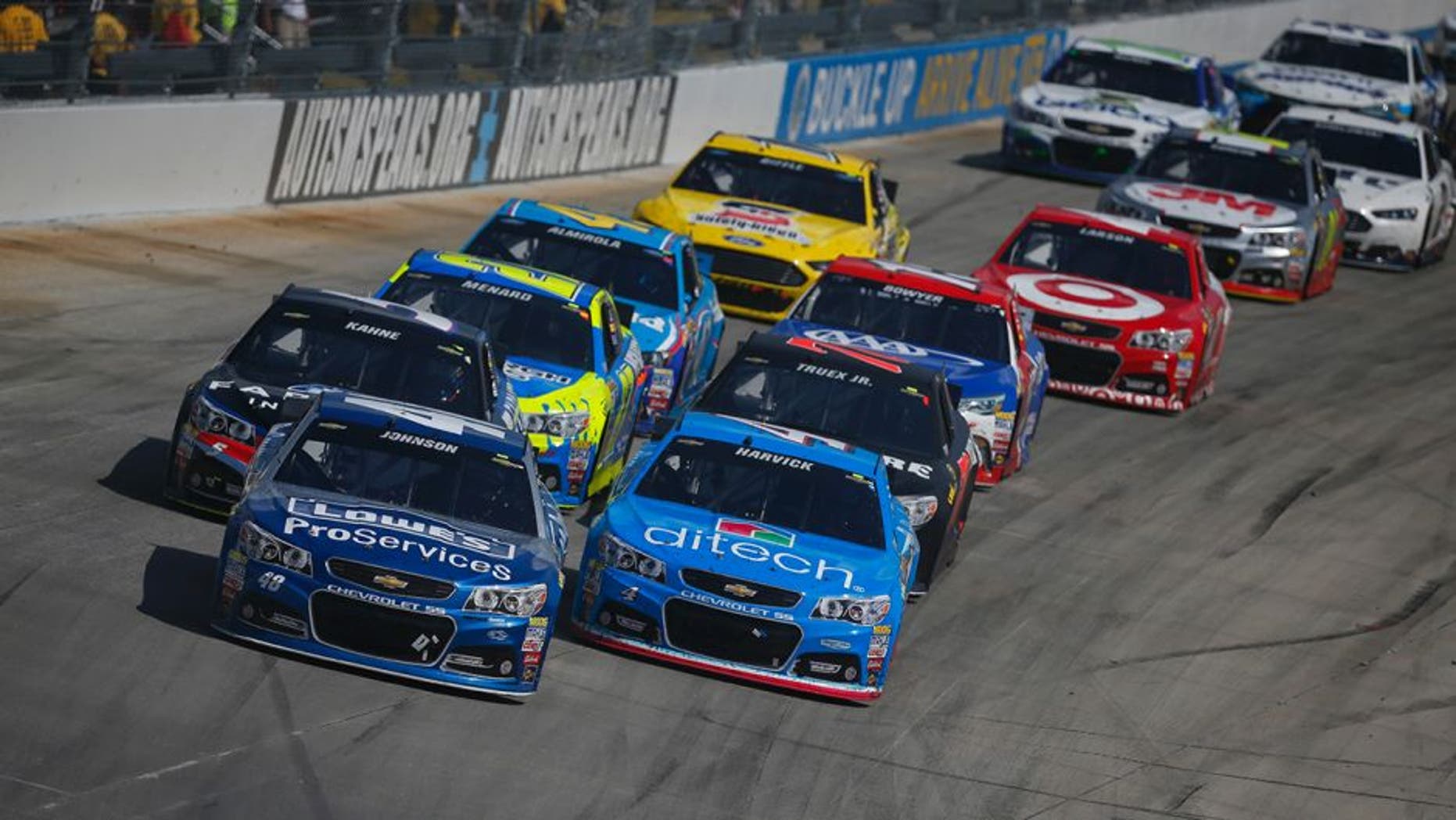 Jimmie Johnson, driver of the #48 Lowe's Pro Services Chevrolet, leads a pack of cars during the NASCAR Sprint Cup Series FedEx 400 Benefiting Autism Speaks at Dover International Speedway on May 31, 2015 in Dover, Delaware.