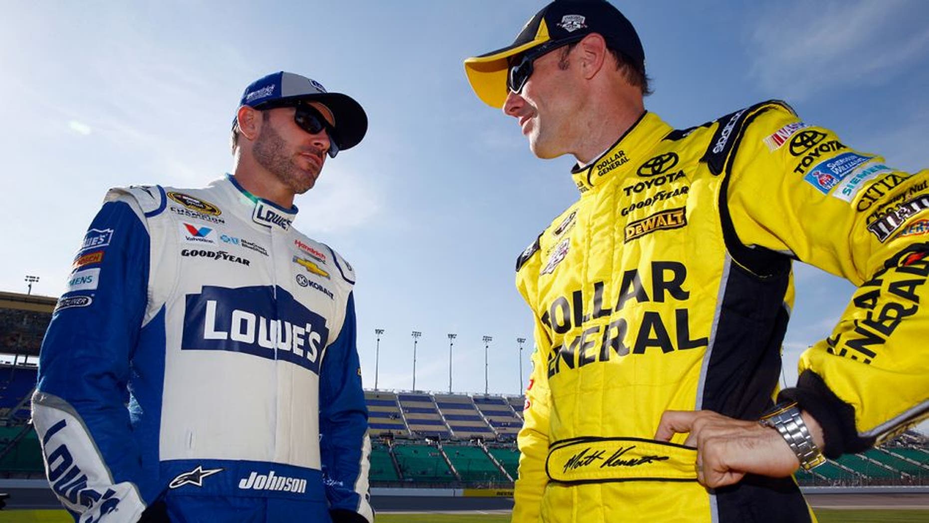 KANSAS CITY, KS - MAY 06: Matt Kenseth, driver of the #20 Dollar General Toyota, speaks with Jimmie Johnson, driver of the #48 Lowe's Chevrolet, during qualifying for the NASCAR Sprint Cup Series Go Bowling 400 at Kansas Speedway on May 6, 2016 in Kansas City, Kansas. (Photo by Jamie Squire/Getty Images)