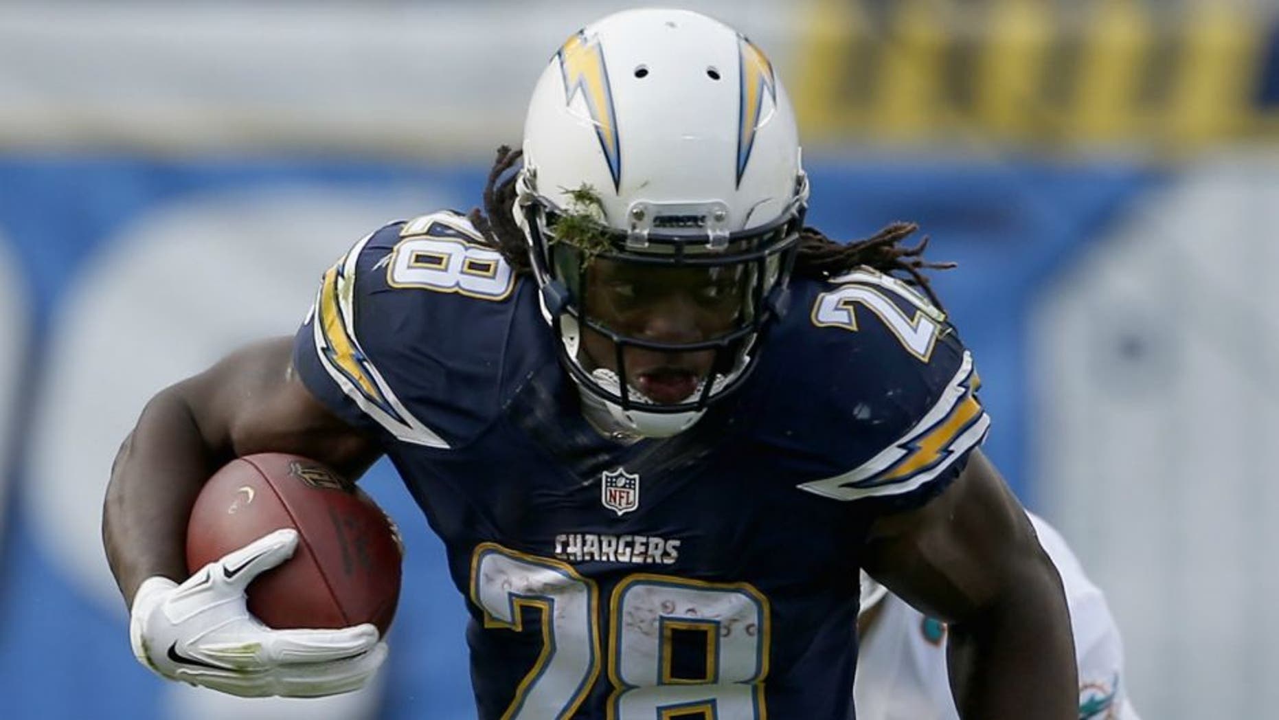 at Qualcomm Stadium on December 20, 2015 in San Diego, California.,SAN DIEGO, CA - DECEMBER 20: Melvin Gordon #28 of the San Diego Chargers runs against Bobby McCain #28 of the Miami Dolphins at Qualcomm Stadium on December 20, 2015 in San Diego, California. (Photo by Todd Warshaw/Getty Images)