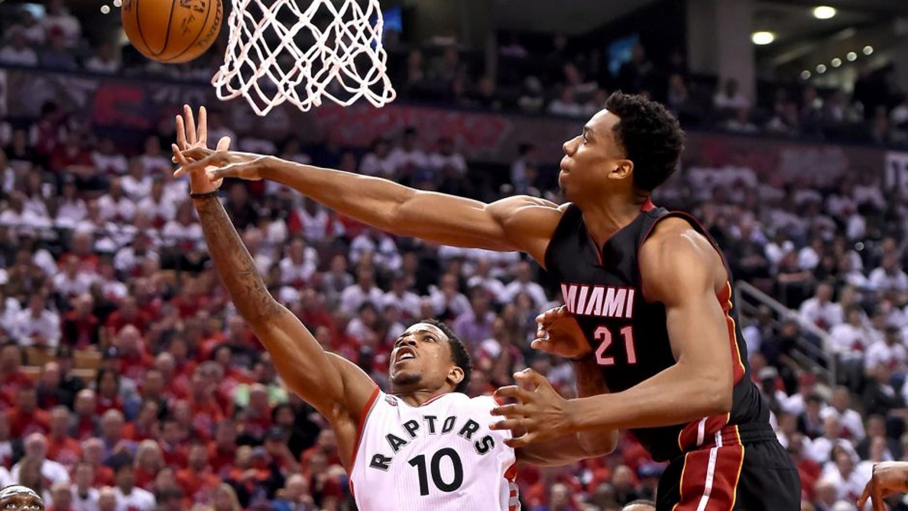 May 3, 2016; Toronto, Ontario, CAN; Toronto Raptors guard DeMar DeRozan (10) has a shot blocked by Miami Heat center Hassan Whiteside (21) in game one of the second round of the NBA Playoffs at Air Canada Centre. The Heat won 102-96. Mandatory Credit: Dan Hamilton-USA TODAY Sports