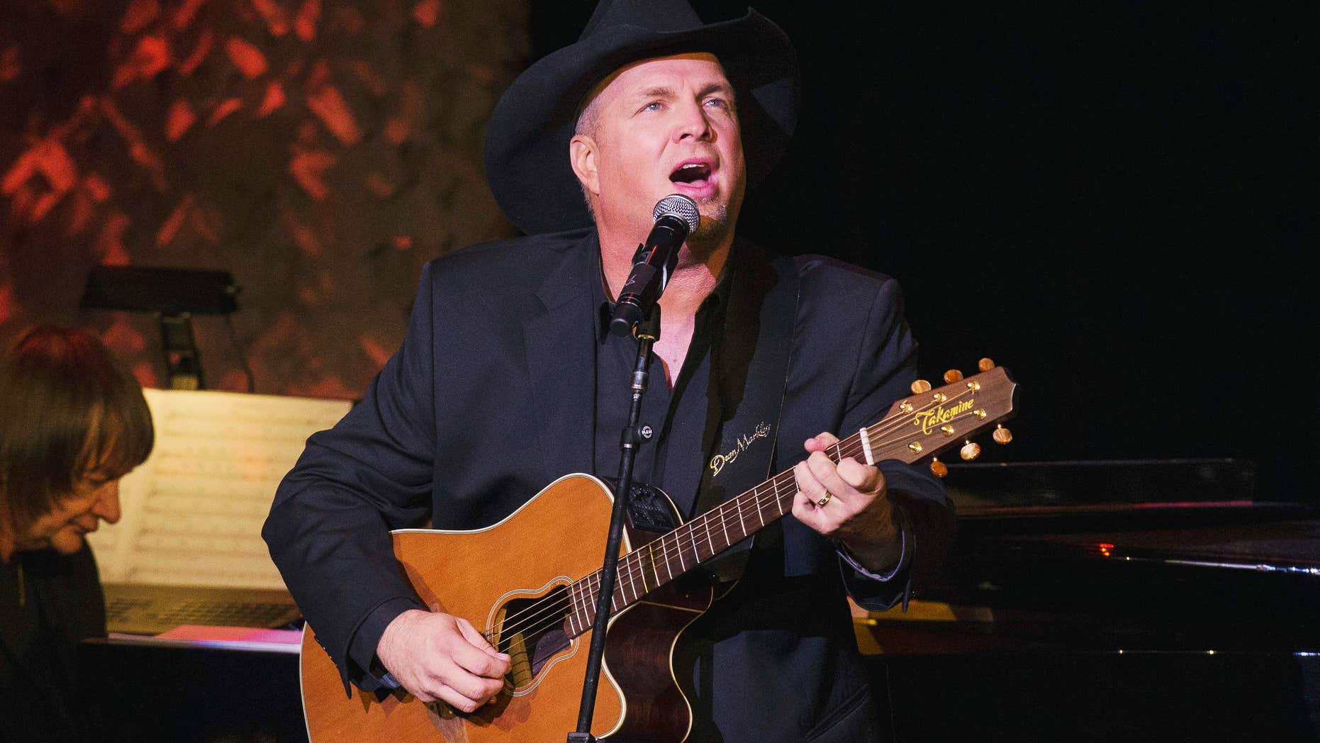 Nov. 17, 2014: Singer and songwriter Garth Brooks performs after accepting an award at the American Society of Composers, Authors and Publishers Centennial Awards in New York.