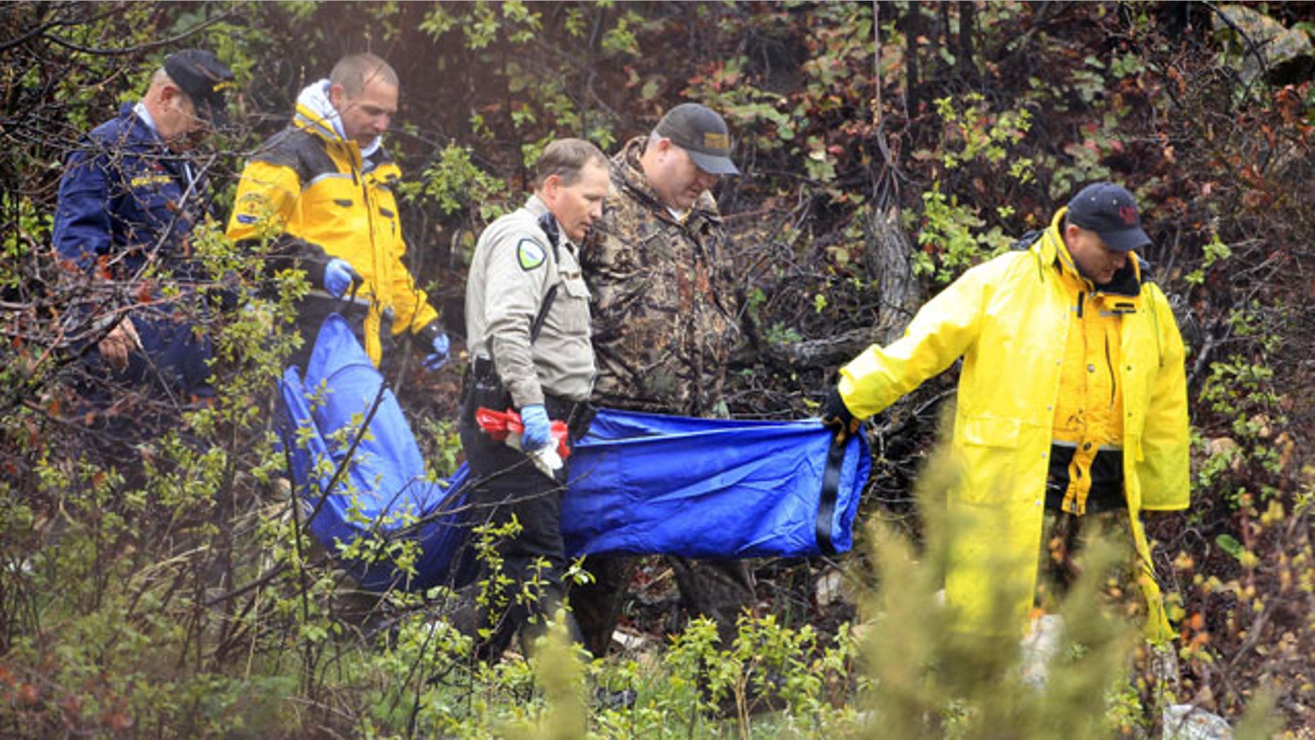 May 11: Investigators with the Weber County Sheriff's Office carry a blue bag down a mountain trail near the Powder Mountain Ski Resort in Eden, Utah following an all-day search for a missing 4-year-old boy from the nearby town of Layton.