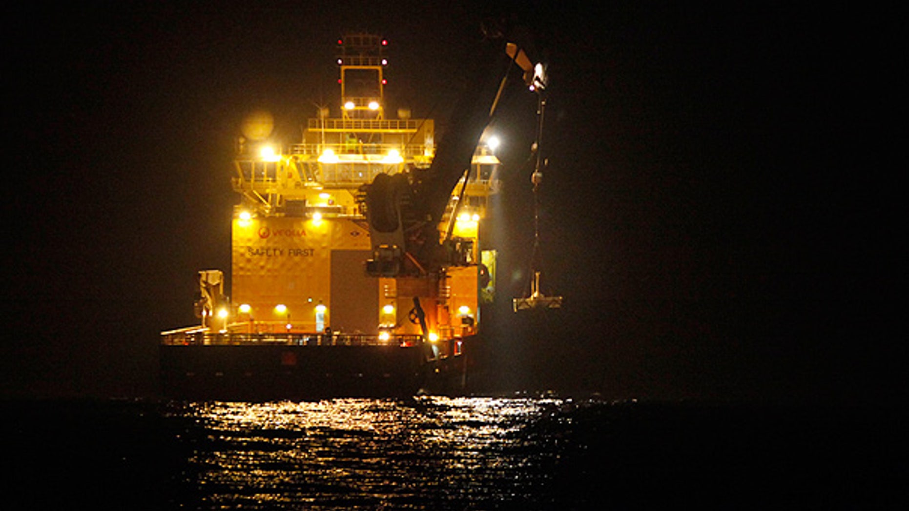 May 11: A ship lowers the top hat device at the site of the Deepwater Horizon oil spill in the Gulf.