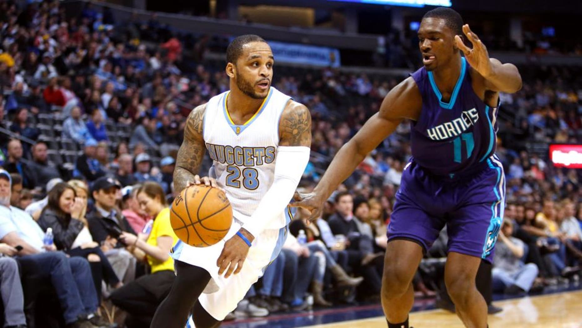 Jan 31, 2015; Denver, CO, USA; Denver Nuggets guard Jameer Nelson (28) drives to the basket against Charlotte Hornets forward Noah Vonleh (11) during the second half at Pepsi Center. The Hornets won 104-86. Mandatory Credit: Chris Humphreys-USA TODAY Sports