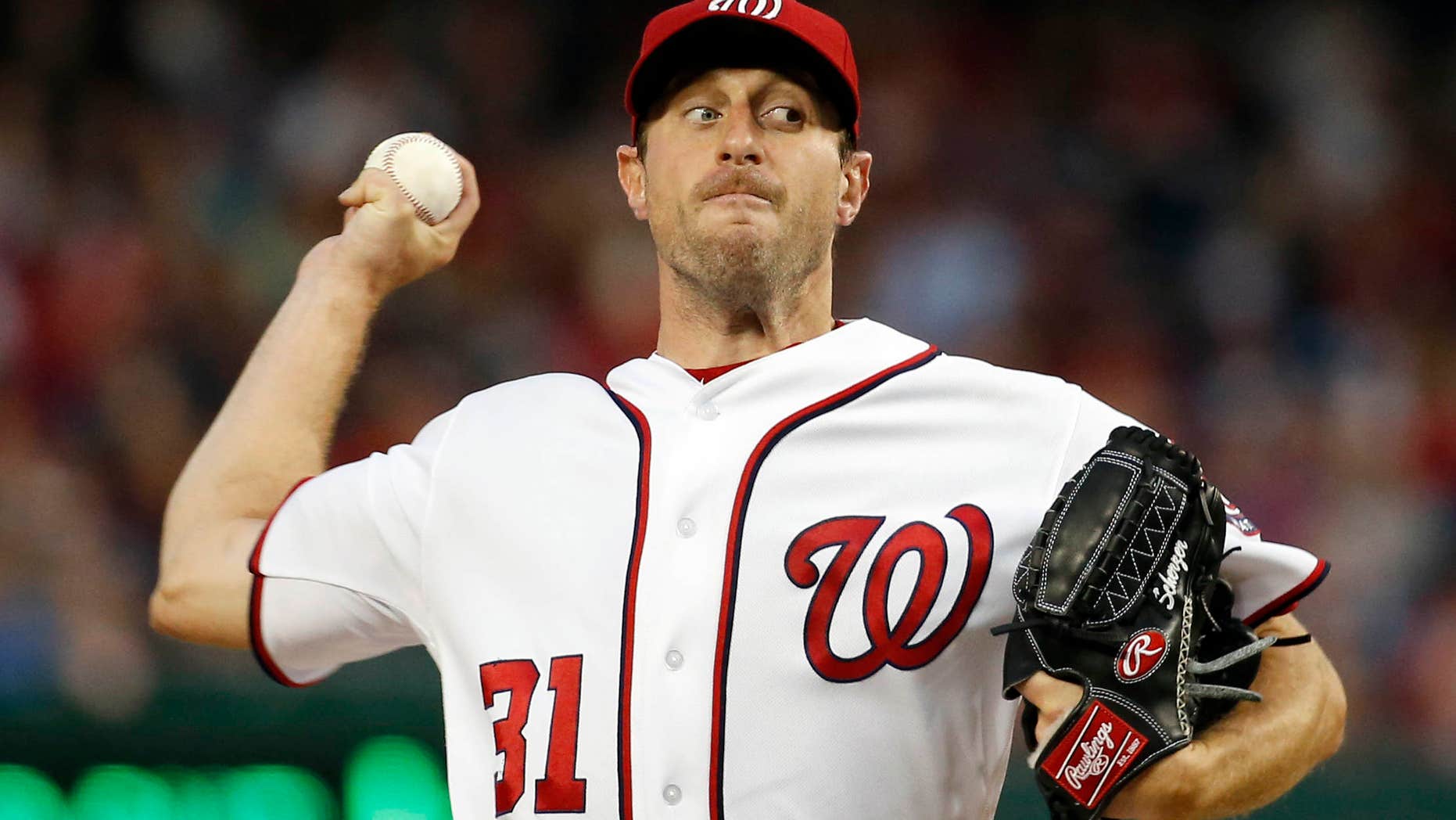 Washington Nationals starting pitcher Max Scherzer throws during the third inning of a baseball game against the Detroit Tigers at Nationals Park, Wednesday, May 11, 2016, in Washington.