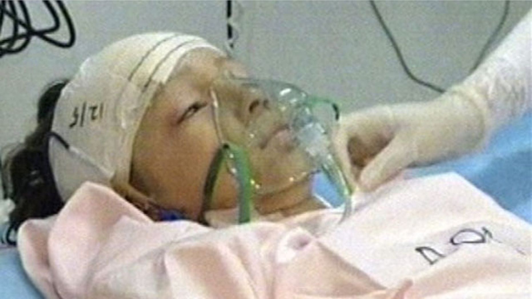 In a photo released by Libya TV, the lone survivor of a Afriqiyah Airways plane crash in Tripoli is seen being treated.