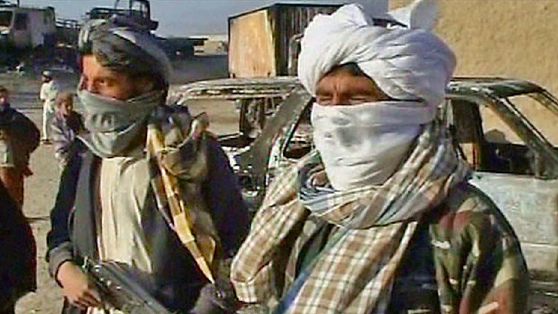 Oct. 20, 2009: Taliban militants are shown after they attacked a military convoy near Kabul, Afghanistan.
