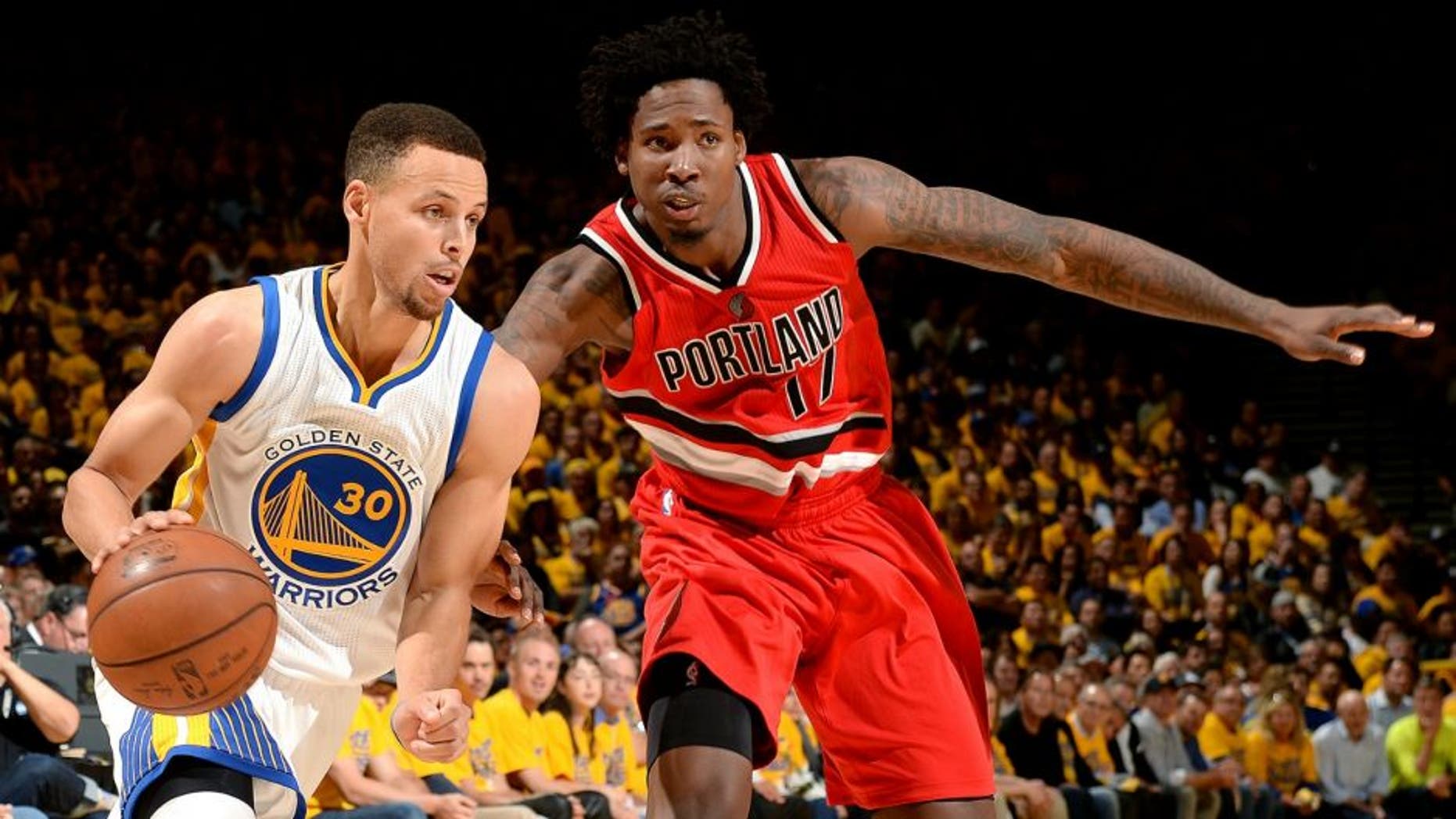 OAKLAND, CA - MAY 11: Stephen Curry #30 of the Golden State Warriors drives to the basket during the game against Ed Davis #17 of the Portland Trail Blazers in Game Five of the Western Conference Semifinals during the 2016 NBA Playoffs on May 11, 2016 at ORACLE Arena in Oakland, California. NOTE TO USER: User expressly acknowledges and agrees that, by downloading and or using this photograph, user is consenting to the terms and conditions of Getty Images License Agreement. Mandatory Copyright Notice: Copyright 2016 NBAE (Photo by Garrett Ellwood/NBAE via Getty Images)