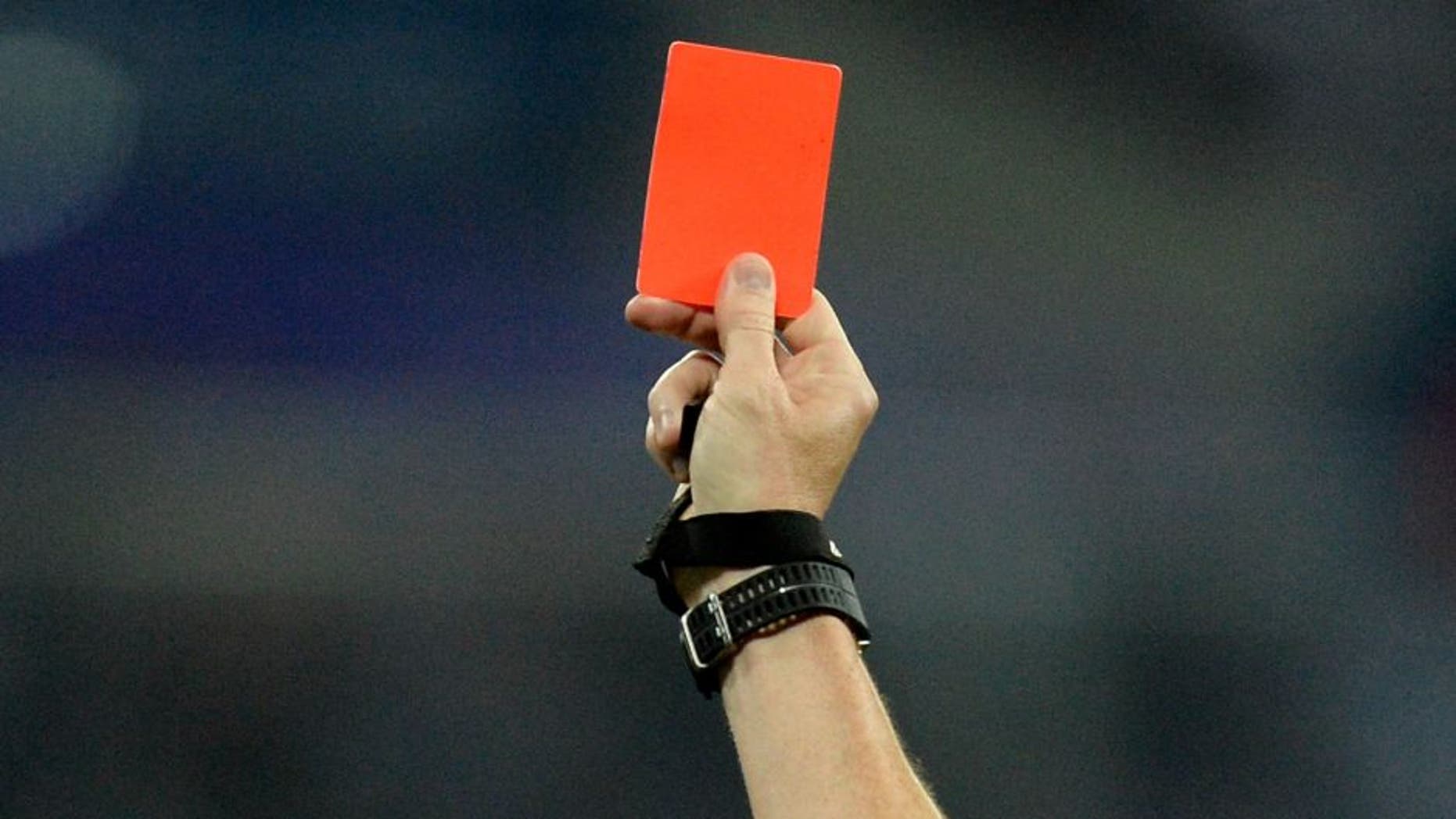 The French referee Ruddy Buquet gives a red card to Monacos Ivorian forward Lacina Traore (L) during the French L1 football match between Olympique Lyonnais (OL) and Association sportive de Monaco (ASM) at the Parc de l'Olympique Lyonnais in Decines-Charpieu, central eastern France, on May 7, 2016. / AFP / ROMAIN LAFABREGUE (Photo credit should read ROMAIN LAFABREGUE/AFP/Getty Images)