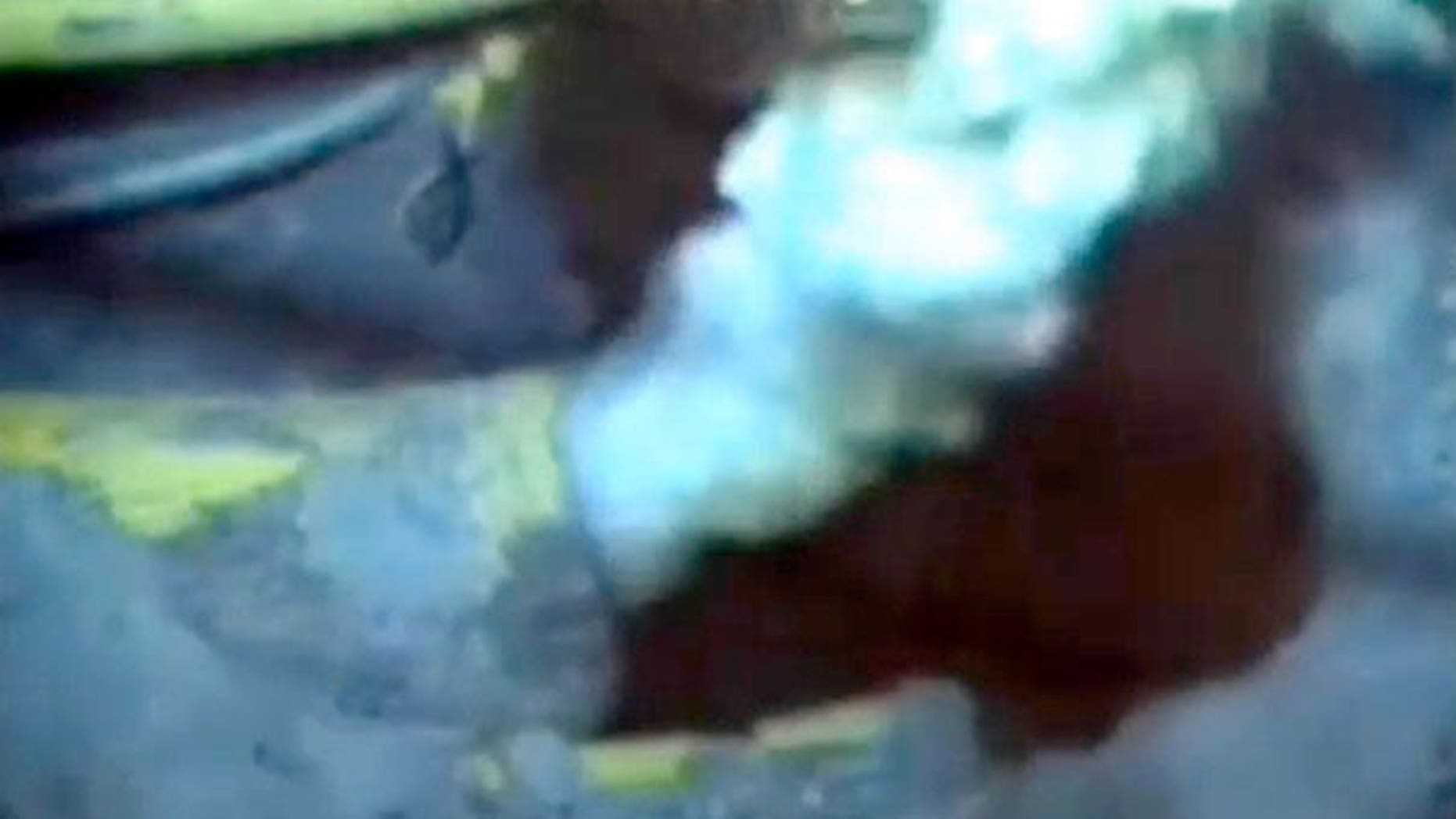 An image from a video of a jagged pipe leaking millions of gallons of oil into the Gulf of Mexico, recorded by a BP camera a mile below the water's surface.